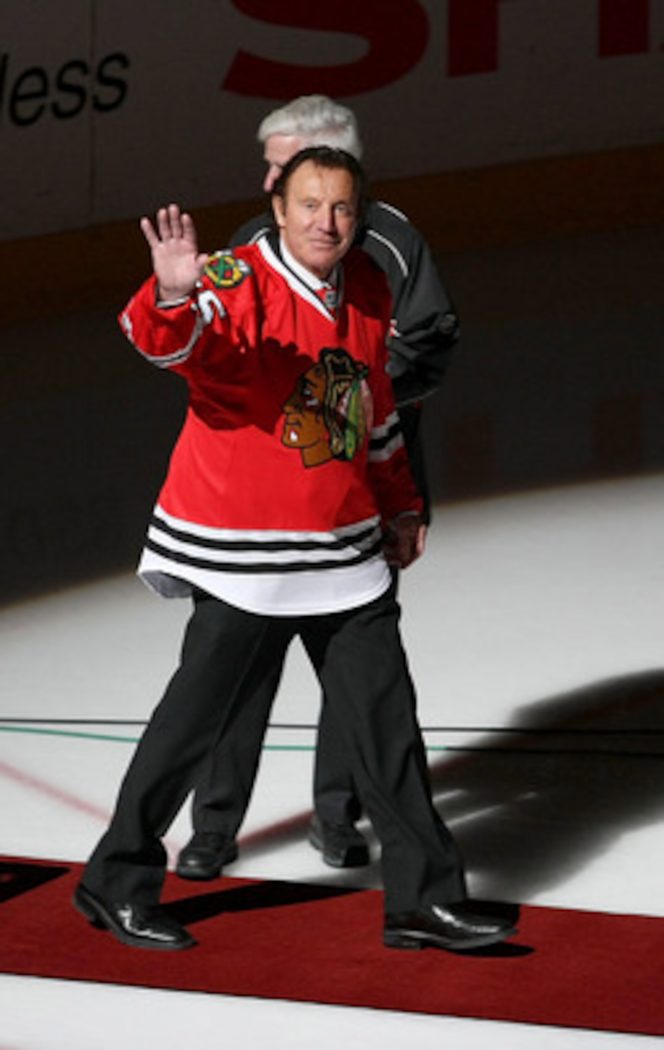 CHICAGO - MARCH 19: Former goaltender Tony Esposito of the Chicago Blackhawks waves to the crowd before being honored at a game between the Blackhawks and the Washington Capitals on March 19, 2008 at the United Center in Chicago, Illinois. (Photo by Jonat