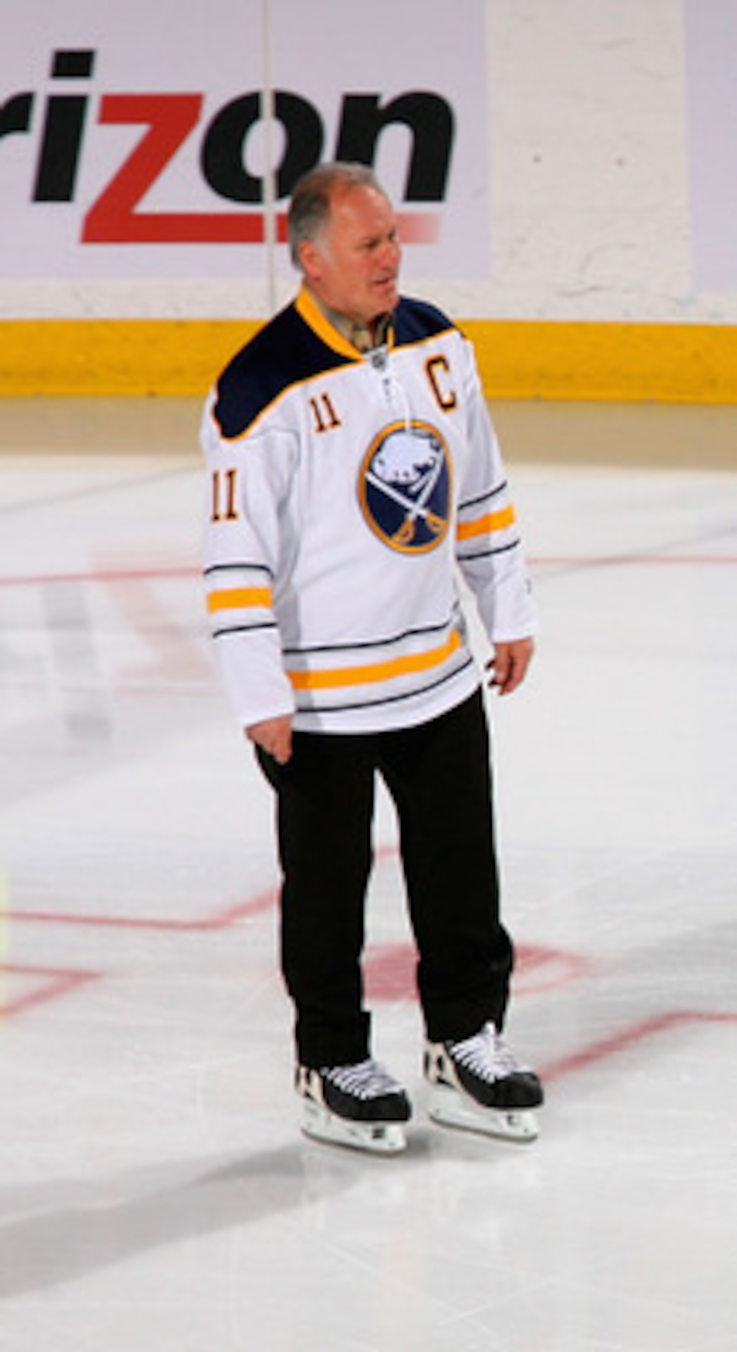 BUFFALO, NY - FEBRUARY 23:  Former Buffalo Sabres players Gilbert Perreault #11, Rene Robert #14 and Rick Martin #7 skate out to meet new Sabre owner Terry Pegula (not shown) during pre game ceremonies prior to play against the Atlanta Thrashers at HSBC A