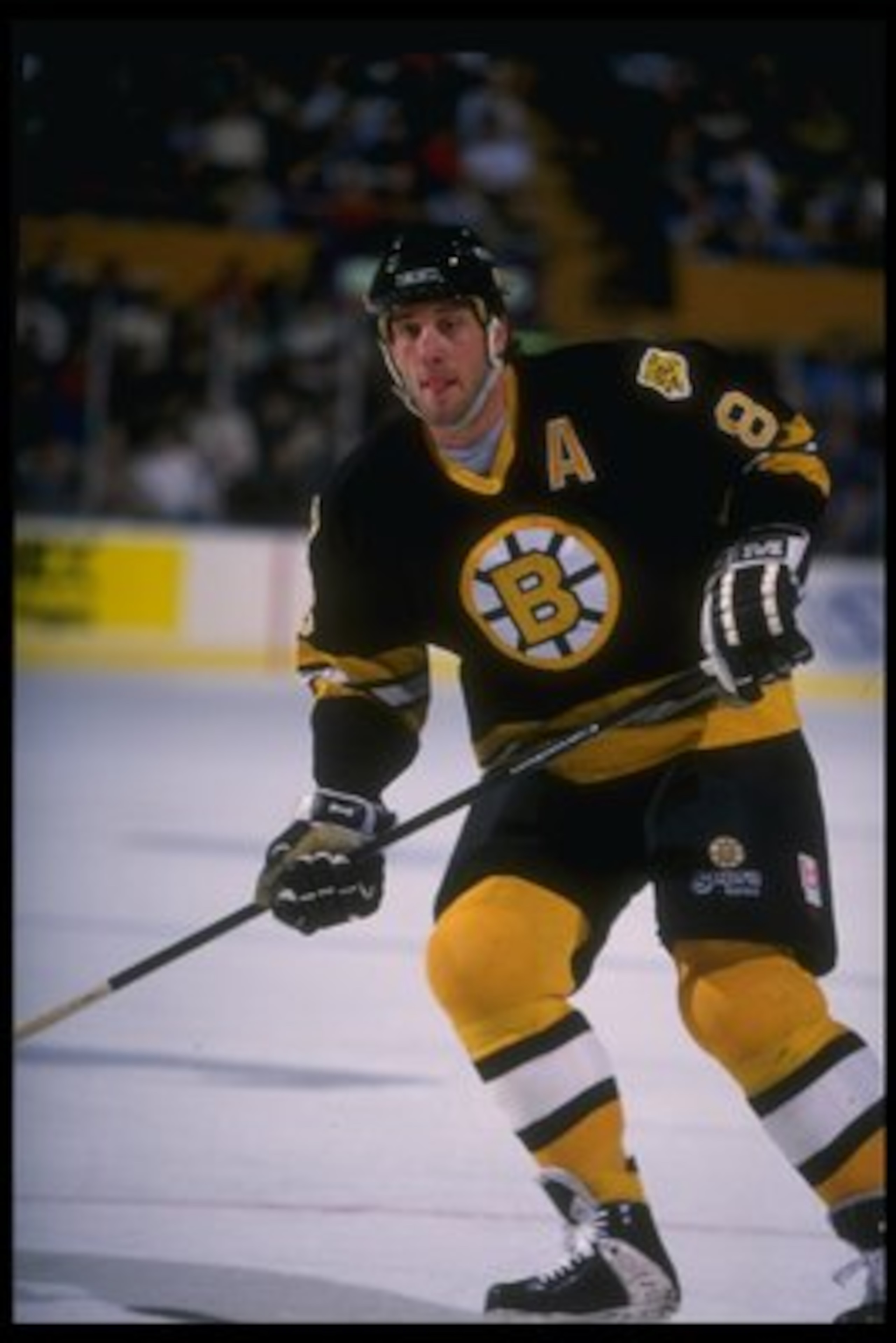 12 Dec 1995: Rightwinger Cam Neely of the Boston Bruins looks on during a game against the Buffalo Sabres at Memorial Auditorium in Buffalo, New York. The Bruins won the game, 2-1.