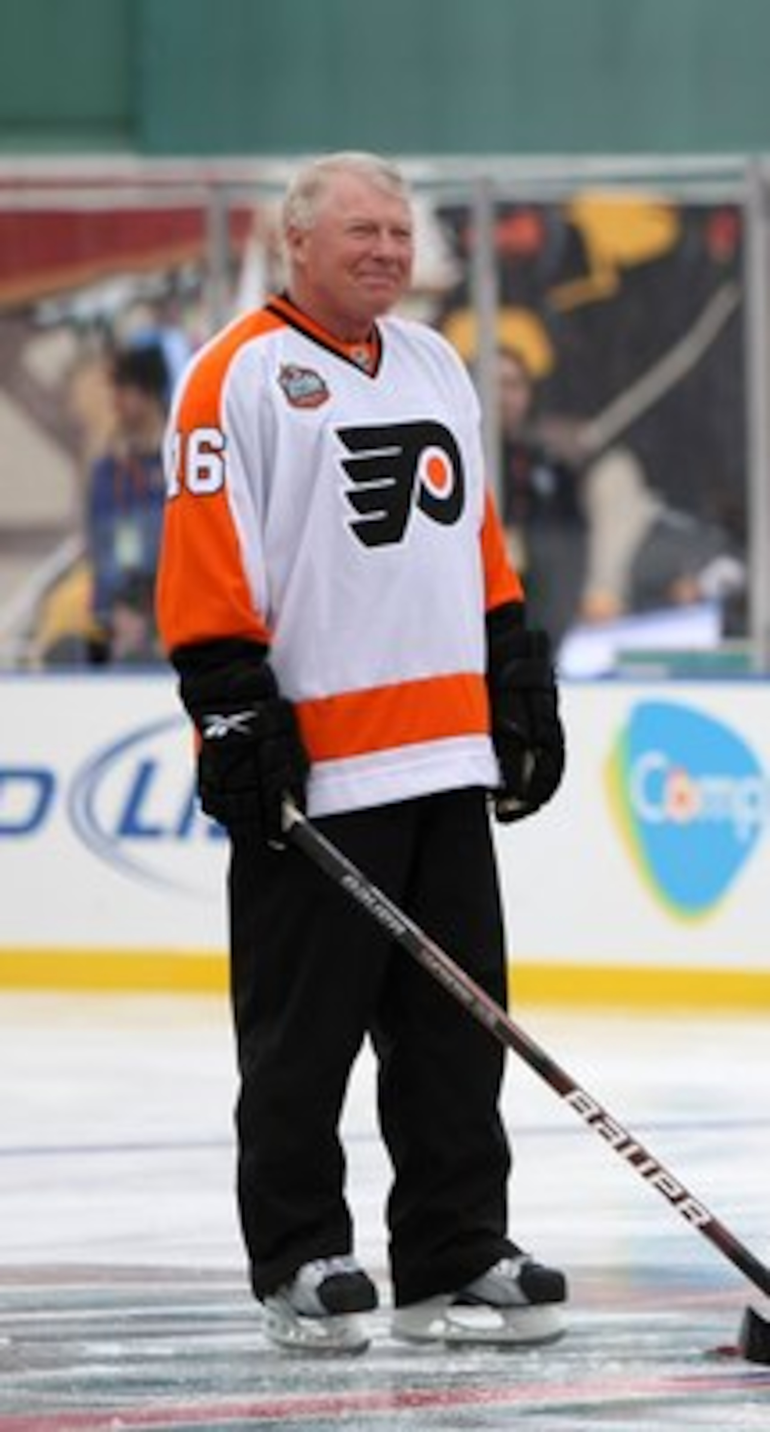 BOSTON - JANUARY 01:  Staff Sergeant Ryan R. LaFrance (C) prepares to drop the ceremonial first puck for Bobby Clarke #16 (L) honorary captain of the Philadelphia Flyers and Bobby Orr #4 (R) honorary captain of the Boston Bruins during the 2010 Bridgeston