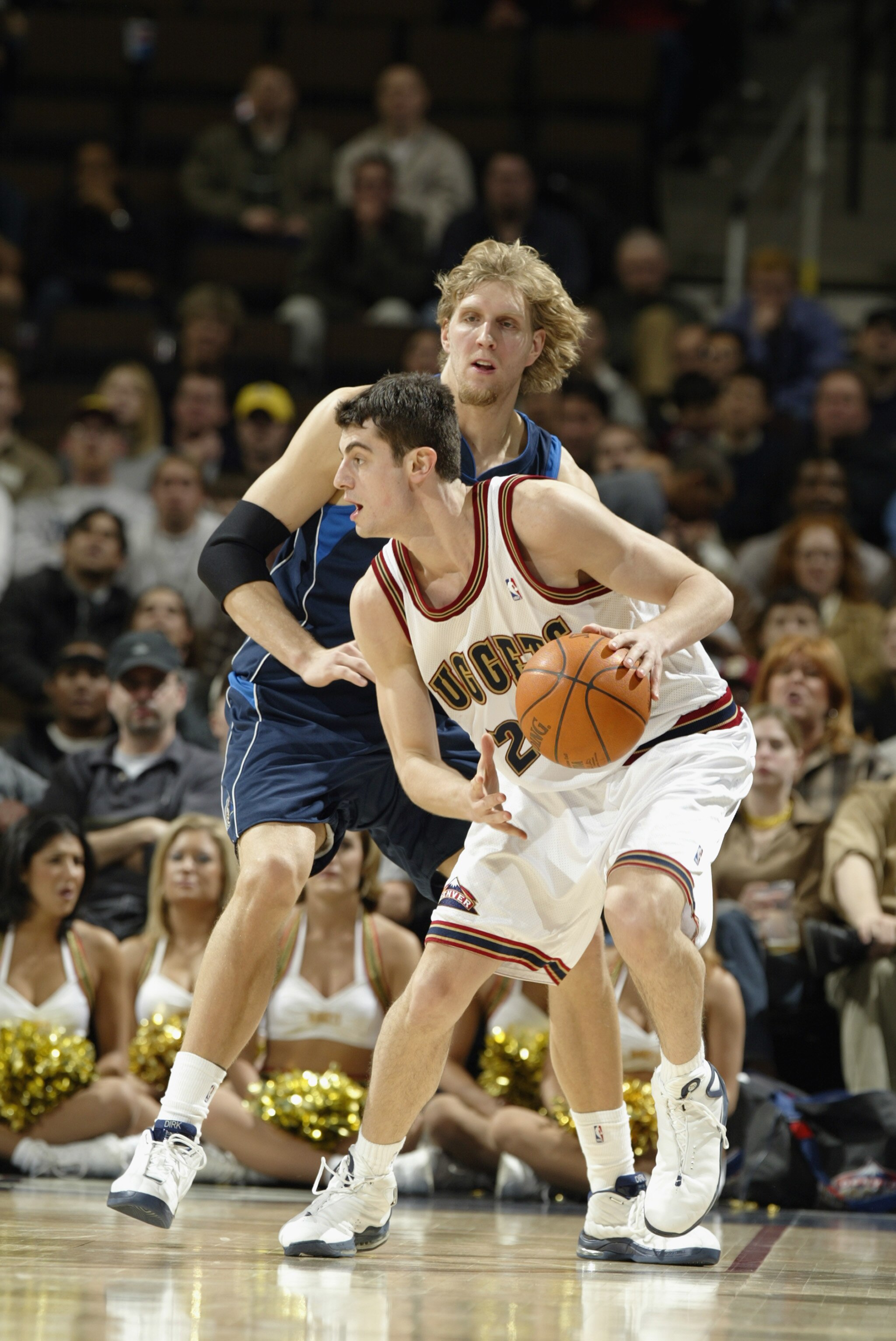 DENVER - DECEMBER 18:  Nikoloz Tskitishvili #22 of the Denver Nuggets is defended by Dirk Nowitzki #41 of the Dallas Mavericks during the game at Pepsi Center on December 18, 2002 in Denver, Colorado.  The Mavs won 80-75.   NOTE TO USER: User expressly ac