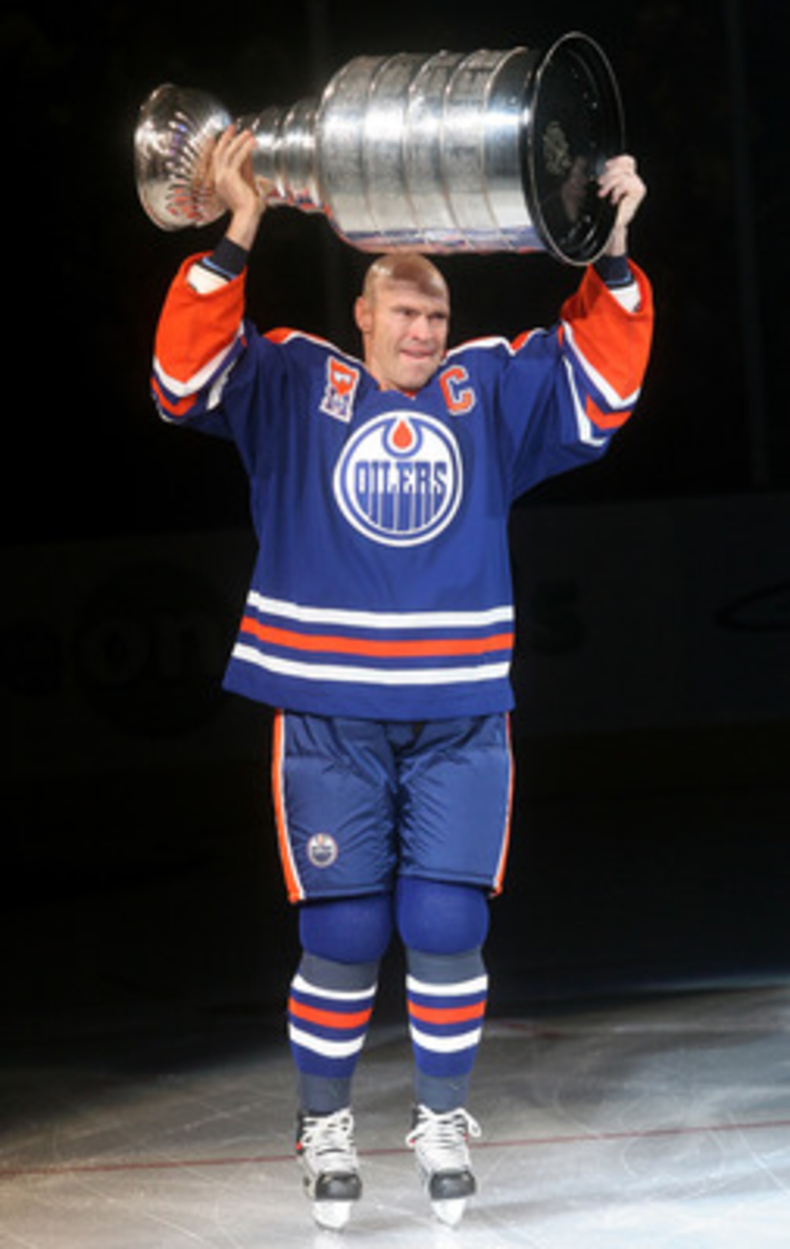 EDMONTON, CANADA - FEBRUARY 27:  Former Edmonton Oilers great Mark Messier #11 hoists the Stanley Cup while skating across the ice during a ceremony to raise his #11 banner to the rafters of Rexall Place prior to the Oilers game against the Phoenix Coyote