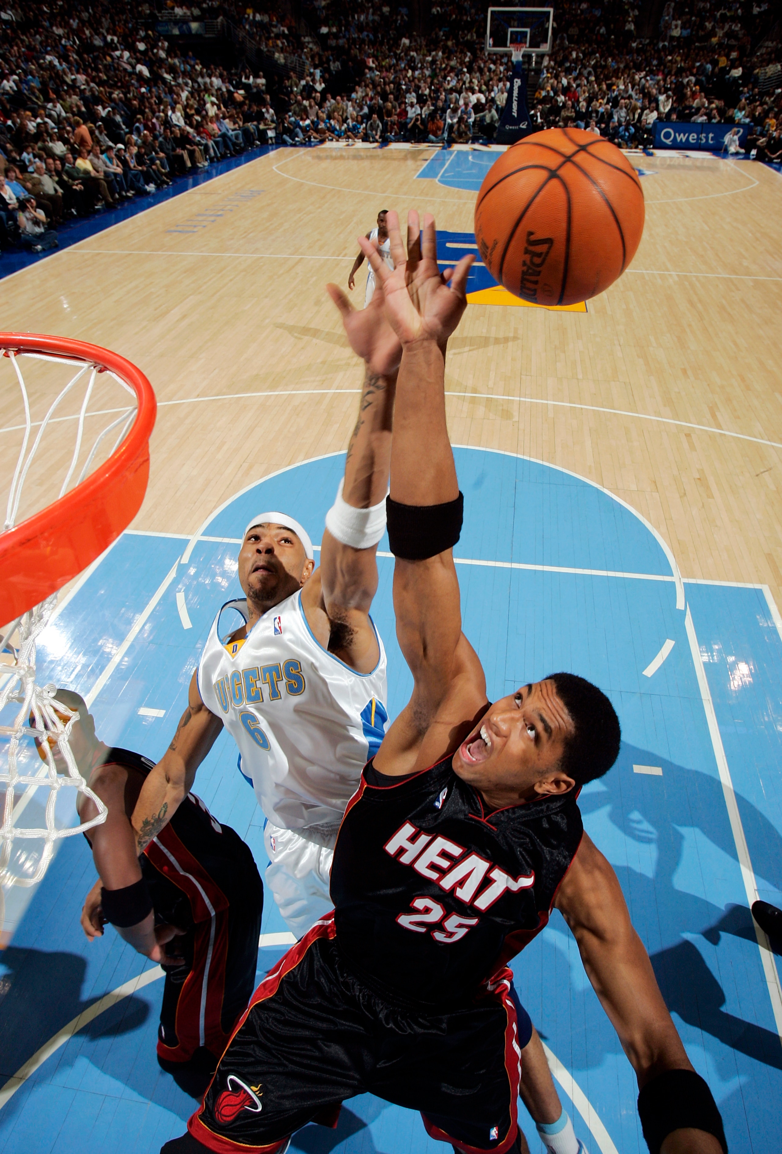 DENVER - DECEMBER 3:  Kenyon Martin #6 of the Denver Nuggets and Wayne Simien #25 of the Miami Heat compete for a rebound in the second half  December 3, 2005 at the Pepsi Center in Denver, Colorado. The Nuggets won 101-99.   NOTE TO USER: User expressly 
