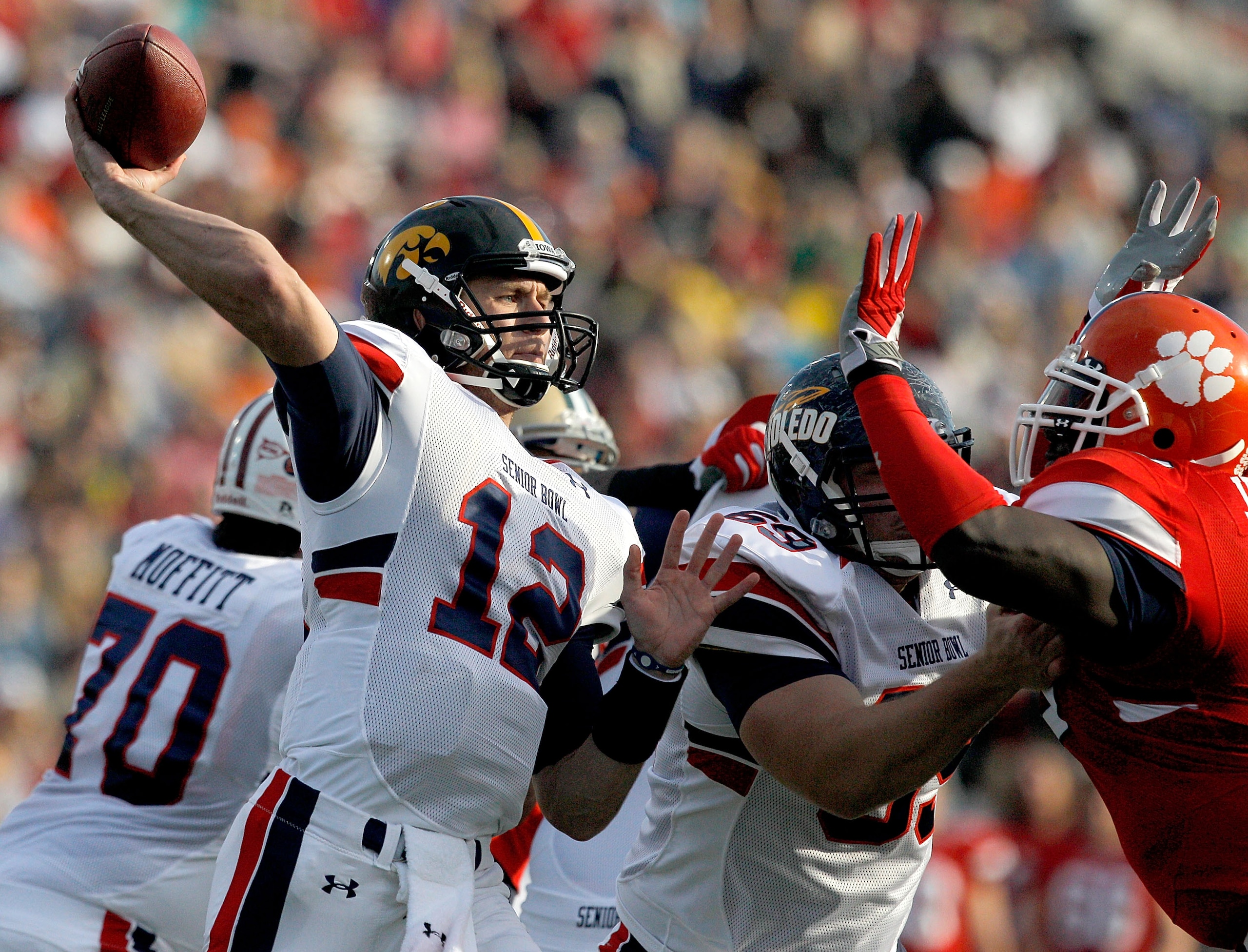 MOBILE, AL - JANUARY 29: Quarterback Ricky Stanzi #12 of the North Team passes over South Team defenders during second quarter of the Under Armour Senior Bowl on January 29, 2011 at Ladd Peebles Stadium in Mobile, Alabama.  (Photo by Sean Gardner/Getty Im