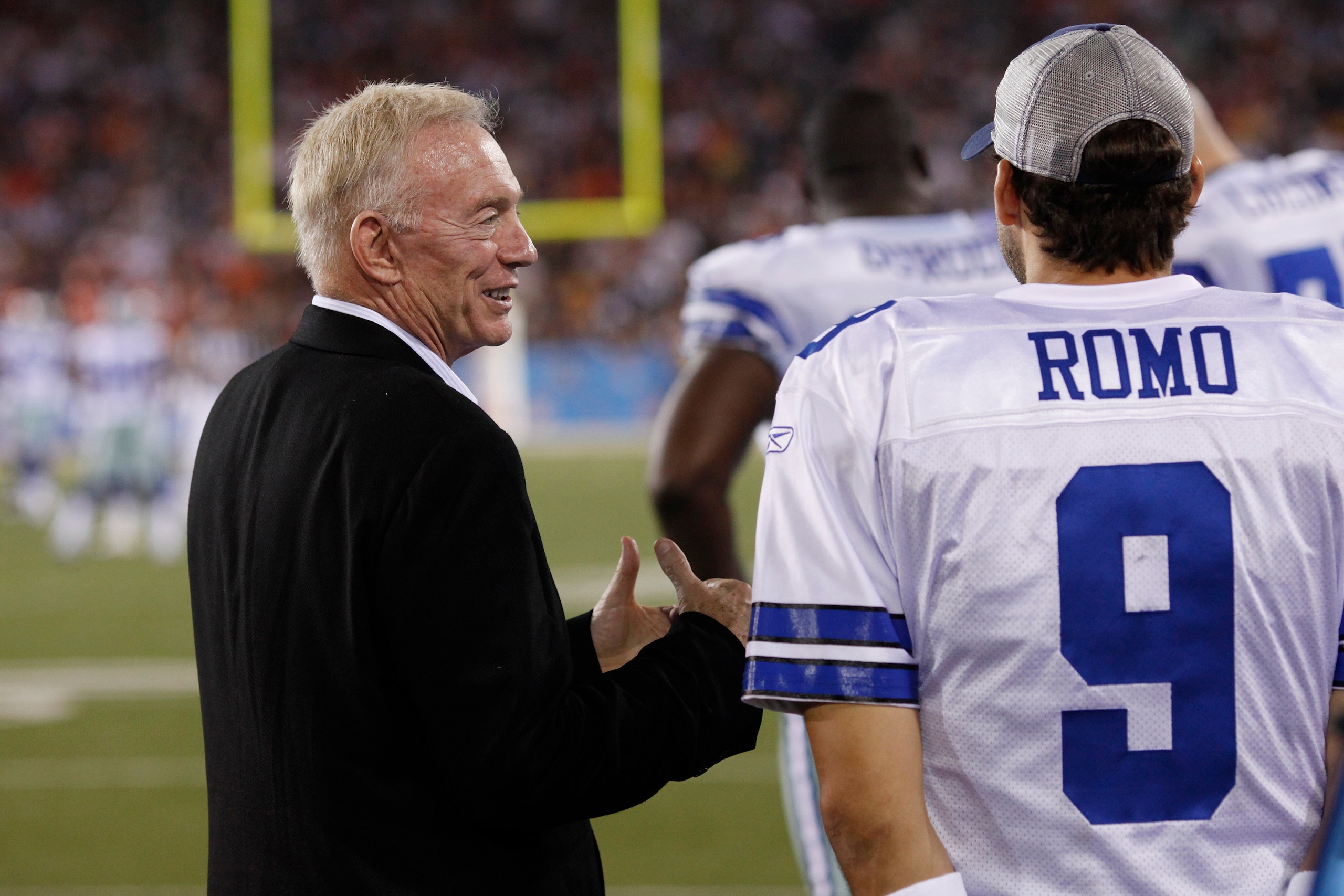 CANTON, OH - AUGUST 8: Dallas Cowboys owner Jerry Jones talks with Tony Romo #9 on the sidelines against the Cincinnati Bengals during the 2010 Pro Football Hall of Fame Game at the Pro Football Hall of Fame Field at Fawcett Stadium on August 8, 2010 in C CANTON, OH - AUGUST 8: Dallas Cowboys owner Jerry Jones talks with Tony Romo #9 on the sidelines against the Cincinnati Bengals during the 2010 Pro Football Hall of Fame Game at the Pro Football Hall of Fame Field at Fawcett Stadium on August 8, 2010 in C