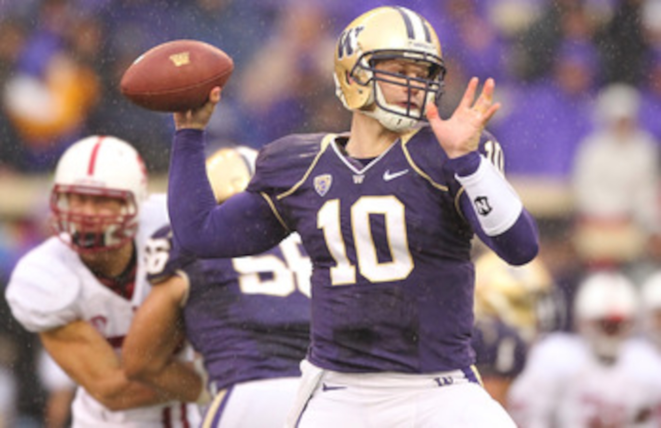 SEATTLE - OCTOBER 30:  Quarterback Jake Locker #10 of the Washington Huskies passes against the Stanford Cardinal on October 30, 2010 at Husky Stadium in Seattle, Washington. (Photo by Otto Greule Jr/Getty Images)