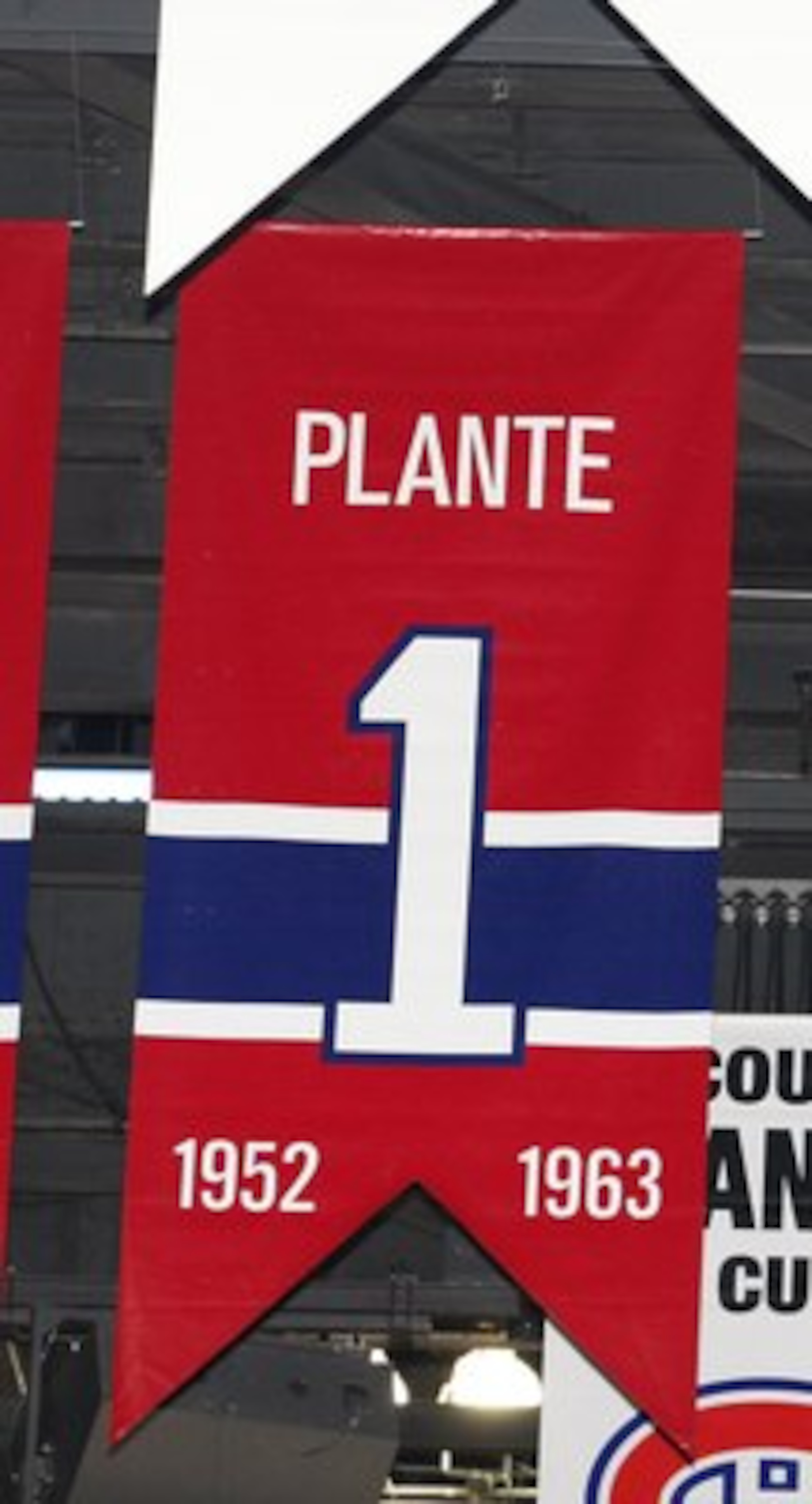 MONTREAL- APRIL 19:  A photo of the banners commemorating the retired jerseys of Jacque Plante, Bernard Geoffrion and Jean Beliveau hanging in the Bell Centre prior to Game Three of the Eastern Conference Quarterfinals between the Washington Capitals and 