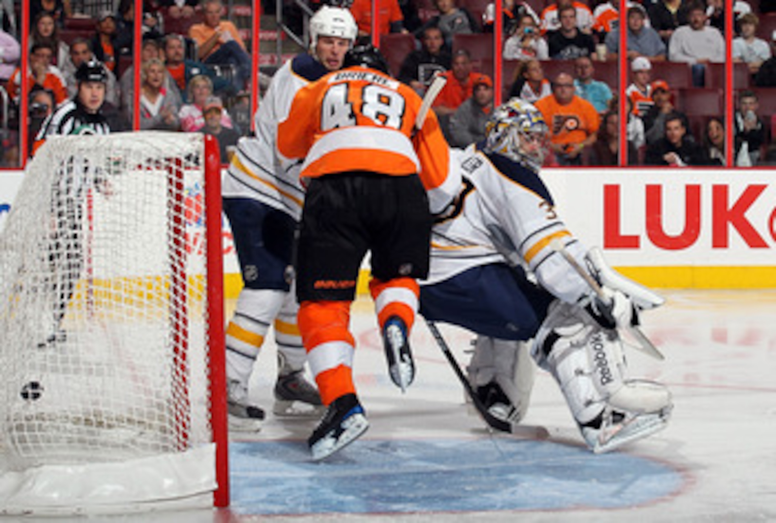 PHILADELPHIA - OCTOBER 26: Ryan Miller #30 of the Buffalo Sabres surrenders a second period goal to Zikolai Zherdev (not pictured) of the Philadelphia Flyers as Daniel Briere #48 skates through the crease on October 26, 2010 at Wells Fargo Center in Phil PHILADELPHIA - OCTOBER 26: Ryan Miller #30 of the Buffalo Sabres surrenders a second period goal to Zikolai Zherdev (not pictured) of the Philadelphia Flyers as Daniel Briere #48 skates through the crease on October 26, 2010 at Wells Fargo Center in Phil