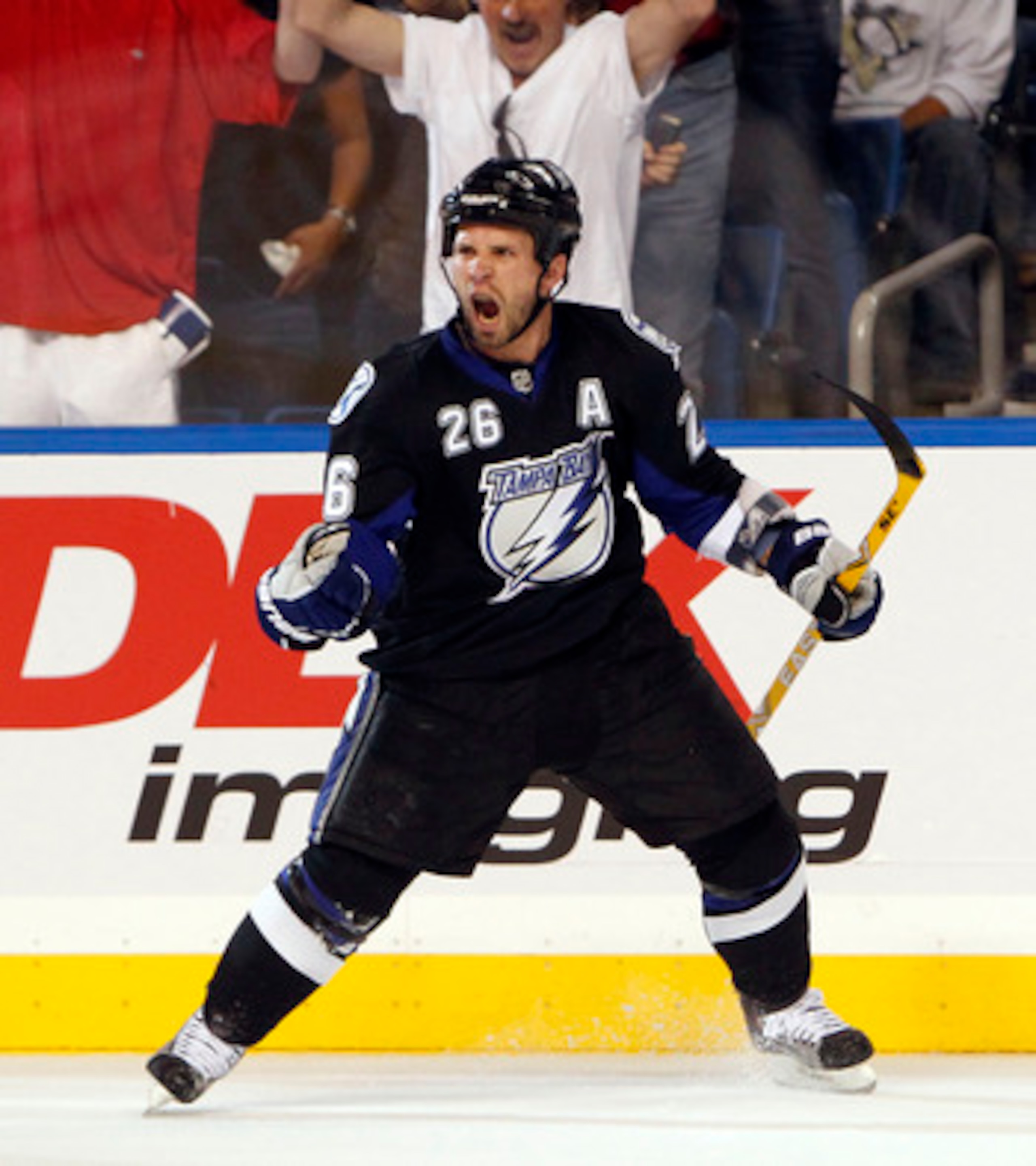 TAMPA, FL - APRIL 20: Martin St. Louis #26 of the Tampa Bay Lightning celebrates a goal against the Pittsburgh Penguins in Game Four of the Eastern Conference Quarterfinals during the 2011 NHL Stanley Cup Playoffs at the St. Pete Times Forum on April 20, TAMPA, FL - APRIL 20: Martin St. Louis #26 of the Tampa Bay Lightning celebrates a goal against the Pittsburgh Penguins in Game Four of the Eastern Conference Quarterfinals during the 2011 NHL Stanley Cup Playoffs at the St. Pete Times Forum on April 20,