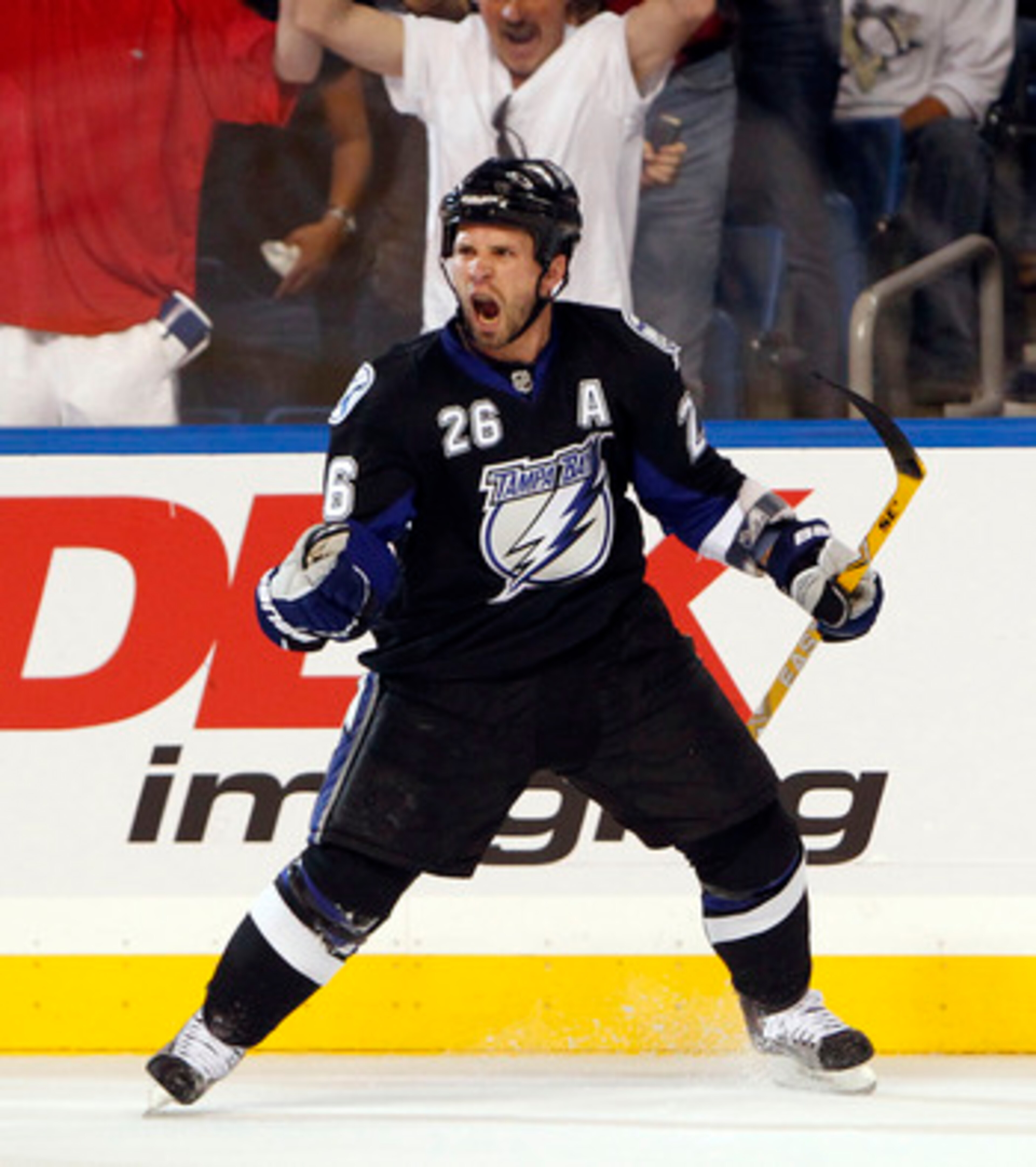 TAMPA, FL - APRIL 20: Martin St. Louis #26 of the Tampa Bay Lightning celebrates a goal against the Pittsburgh Penguins in Game Four of the Eastern Conference Quarterfinals during the 2011 NHL Stanley Cup Playoffs at the St. Pete Times Forum on April 20,