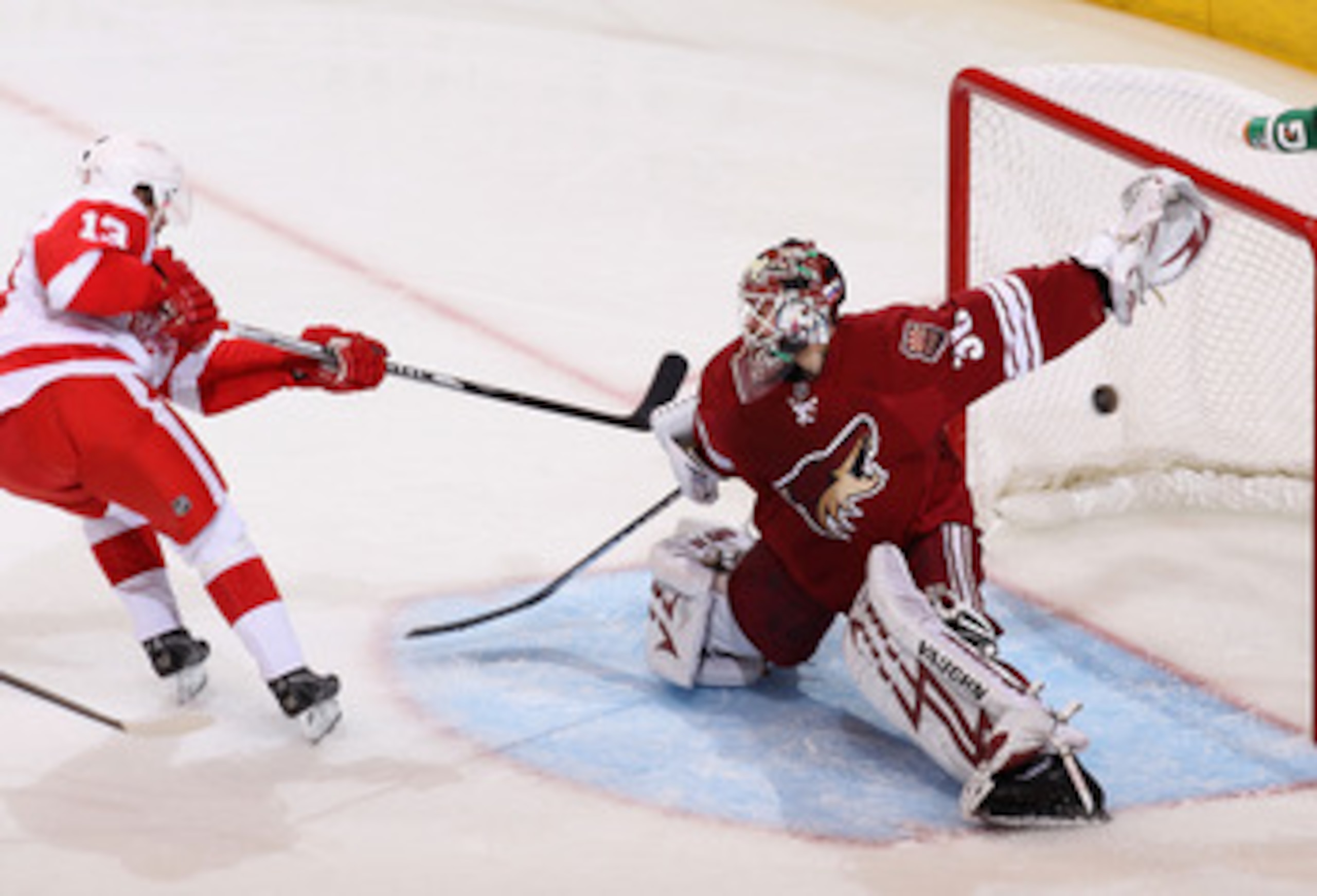 GLENDALE, AZ - APRIL 27: Goaltender Ilya Bryzgalov #30 of the Phoenix Coyotes is unable to stop a second period goal scored by Pavel Datsyuk #13 of the Detroit Red Wings in Game Seven of the Western Conference Quarterfinals during the 2010 NHL Stanley Cu GLENDALE, AZ - APRIL 27: Goaltender Ilya Bryzgalov #30 of the Phoenix Coyotes is unable to stop a second period goal scored by Pavel Datsyuk #13 of the Detroit Red Wings in Game Seven of the Western Conference Quarterfinals during the 2010 NHL Stanley Cu