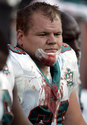 BATON ROUGE, LA - OCTOBER 30:  Seth McKinney #68 of the Miami Dolphins sits on the sideline after cutting his chin during a game against  the New Orleans Saints at Tiger Stadium on the Louisiana State University campus in Baton Rouge, Louisiana on October