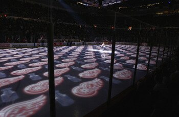 DETROIT, MI - MAY 31:  The logo of the Detroit Red Wings is lit up on the ice prior to the start of game seven of the Western Conference finals during the Stanley Cup playoffs against the Colorado Avalanche at Joe Louis Arena in Detroit, Michigan on May 3