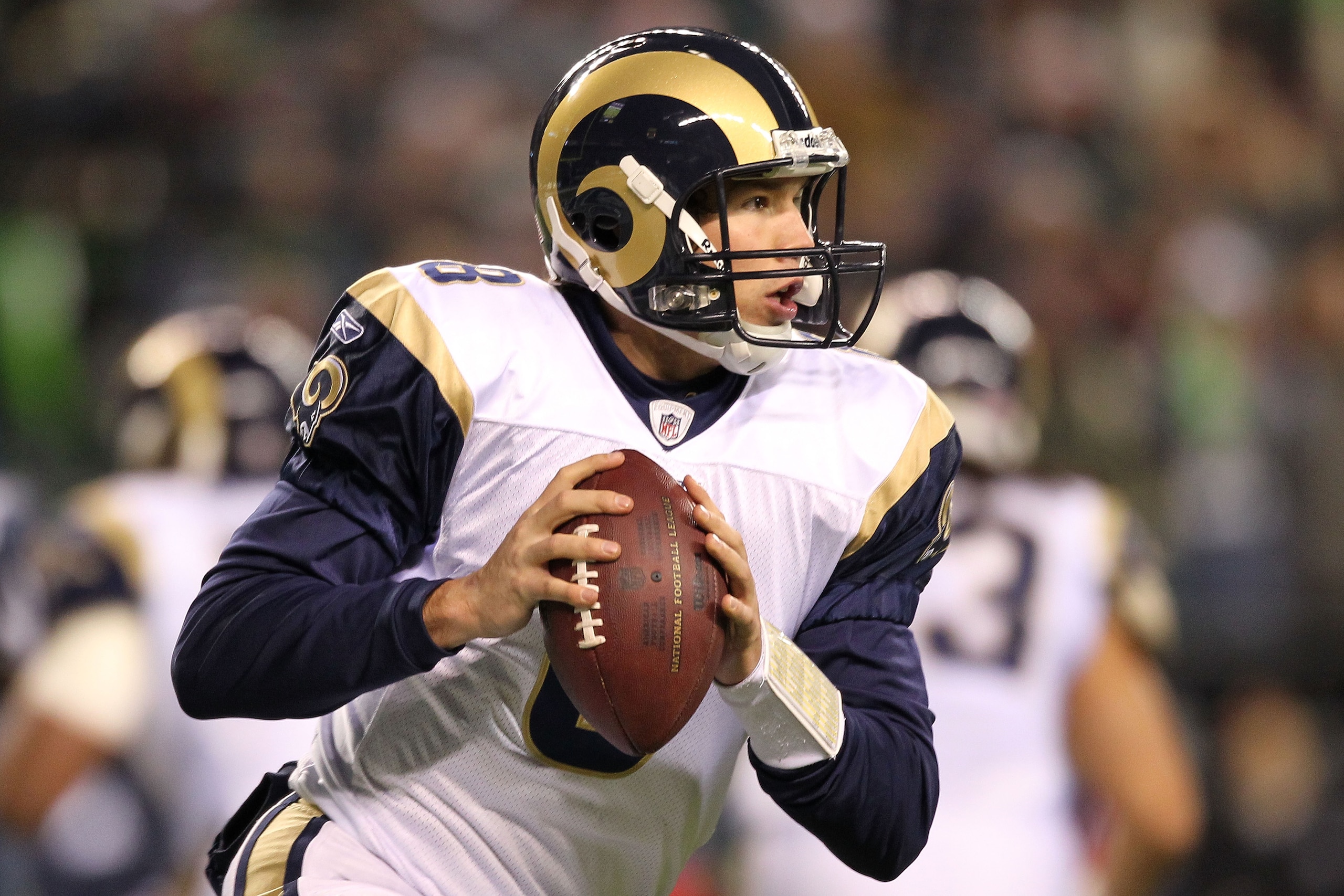 SEATTLE, WA - JANUARY 02: Quarterback Sam Bradford #8 of the St. Louis Rams looks to pass against the Seattle Seahawks during their game at Qwest Field on January 2, 2011 in Seattle, Washington. (Photo by Otto Greule Jr/Getty Images) SEATTLE, WA - JANUARY 02: Quarterback Sam Bradford #8 of the St. Louis Rams looks to pass against the Seattle Seahawks during their game at Qwest Field on January 2, 2011 in Seattle, Washington. (Photo by Otto Greule Jr/Getty Images)