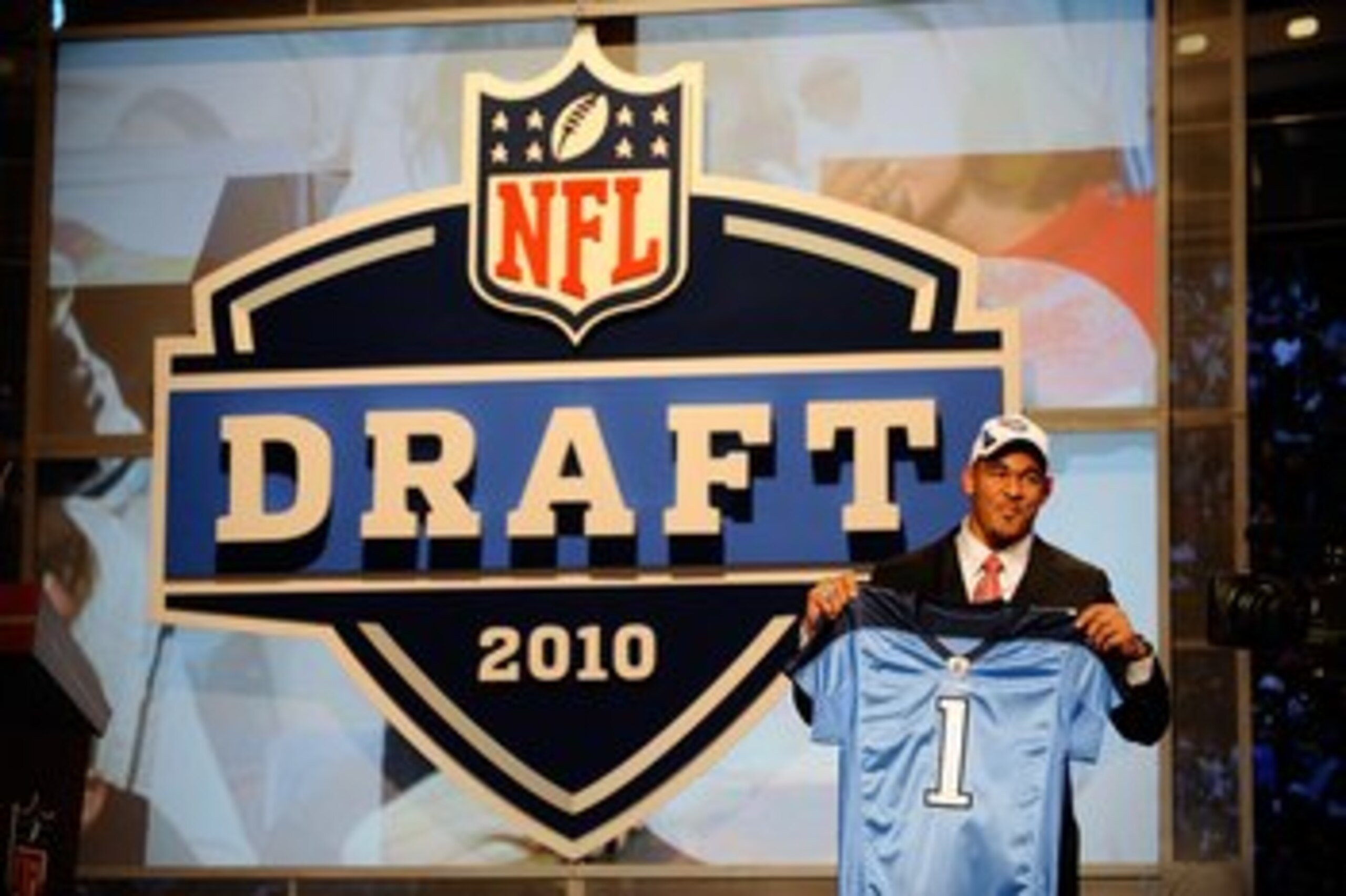 NEW YORK - APRIL 22:  Derrick Morgan from the Georgia Tech Yellow Jackets holds up a Tennessee Titans jersey after the Titans selected Morgan number 16 overall during the first round of the 2010 NFL Draft at Radio City Music Hall on April 22, 2010 in New 