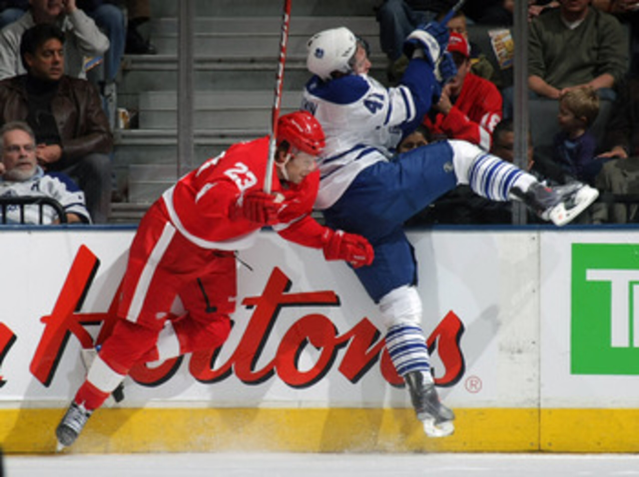 TORONTO, ON - NOVEMBER 07: Nikolai Kulemin #41 of the Toronto Maple Leafs is hit by Brad Stuart #23 of the Detroit Red Wings at the Air Canada Centre on November 7, 2009 in Toronto, Canada. (Photo by Bruce Bennett/Getty Images) TORONTO, ON - NOVEMBER 07: Nikolai Kulemin #41 of the Toronto Maple Leafs is hit by Brad Stuart #23 of the Detroit Red Wings at the Air Canada Centre on November 7, 2009 in Toronto, Canada. (Photo by Bruce Bennett/Getty Images)
