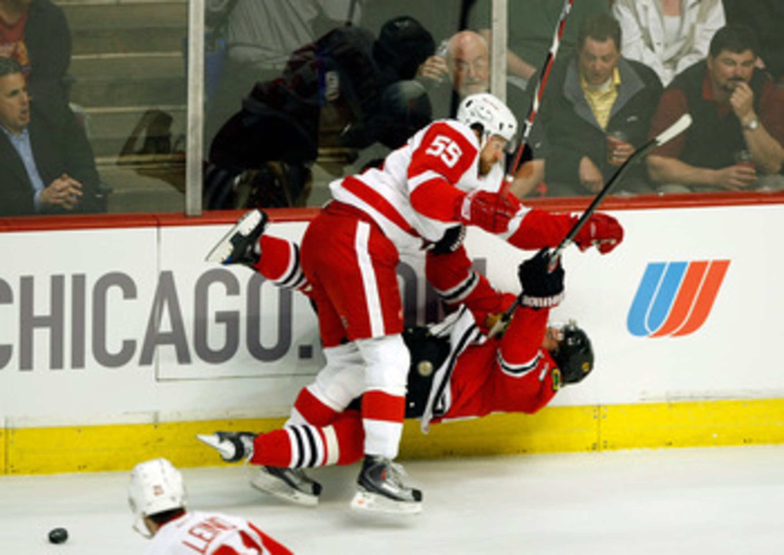 CHICAGO - MAY 22: Martin Havlat #24 of the Chicago Blackhawks checked hard to the ice by Niklas Kronwall #55 of the Detroit Red Wings during the first period of Game Three of the Western Conference Championship Round of the 2009 Stanley Cup Playoffs on M CHICAGO - MAY 22: Martin Havlat #24 of the Chicago Blackhawks checked hard to the ice by Niklas Kronwall #55 of the Detroit Red Wings during the first period of Game Three of the Western Conference Championship Round of the 2009 Stanley Cup Playoffs on M