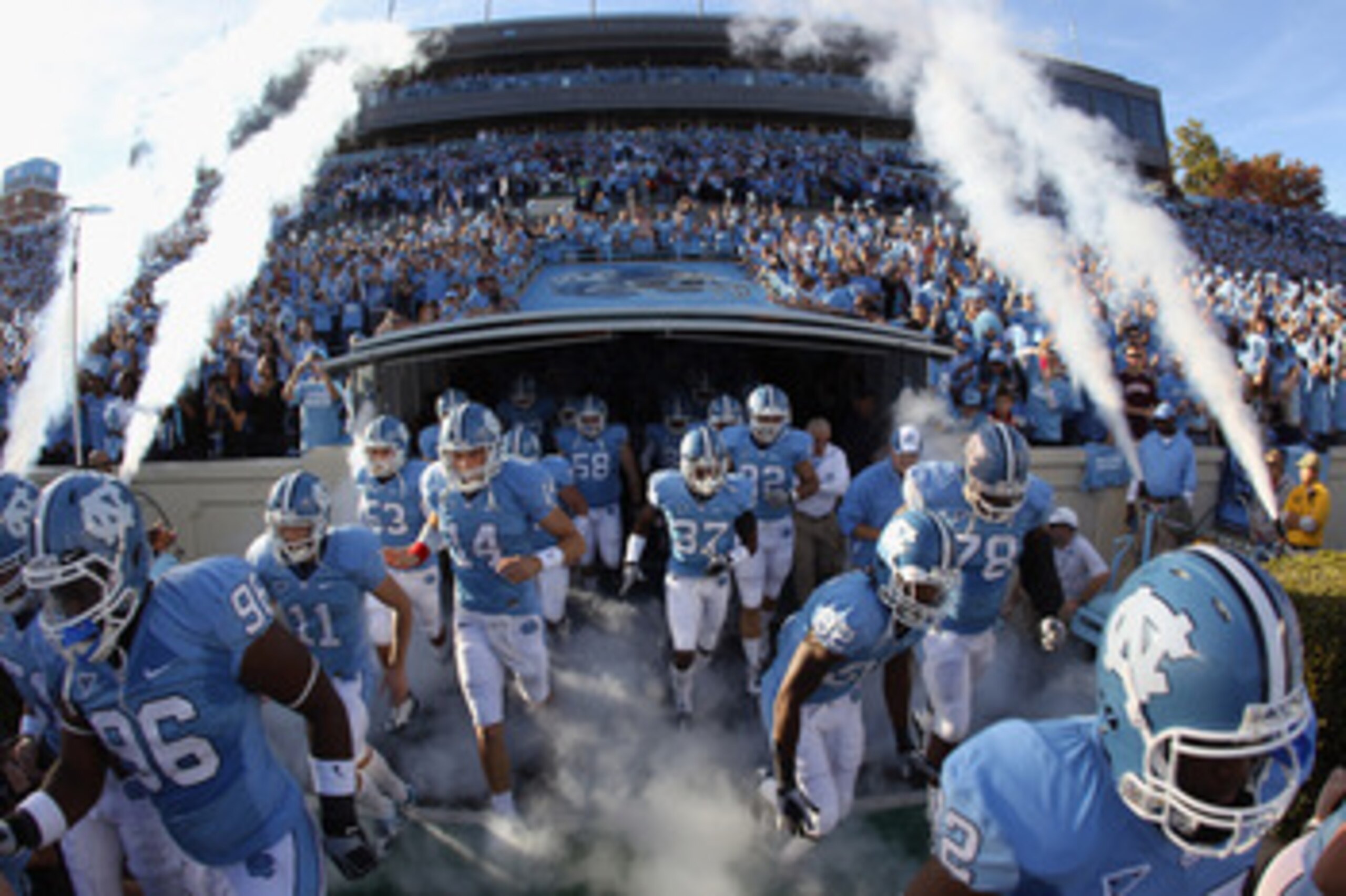 CHAPEL HILL, NC - NOVEMBER 13:  The North Carolina Tar Heels run onto the field before their game against the Virginia Tech Hokies at Kenan Stadium on November 13, 2010 in Chapel Hill, North Carolina.  (Photo by Streeter Lecka/Getty Images)