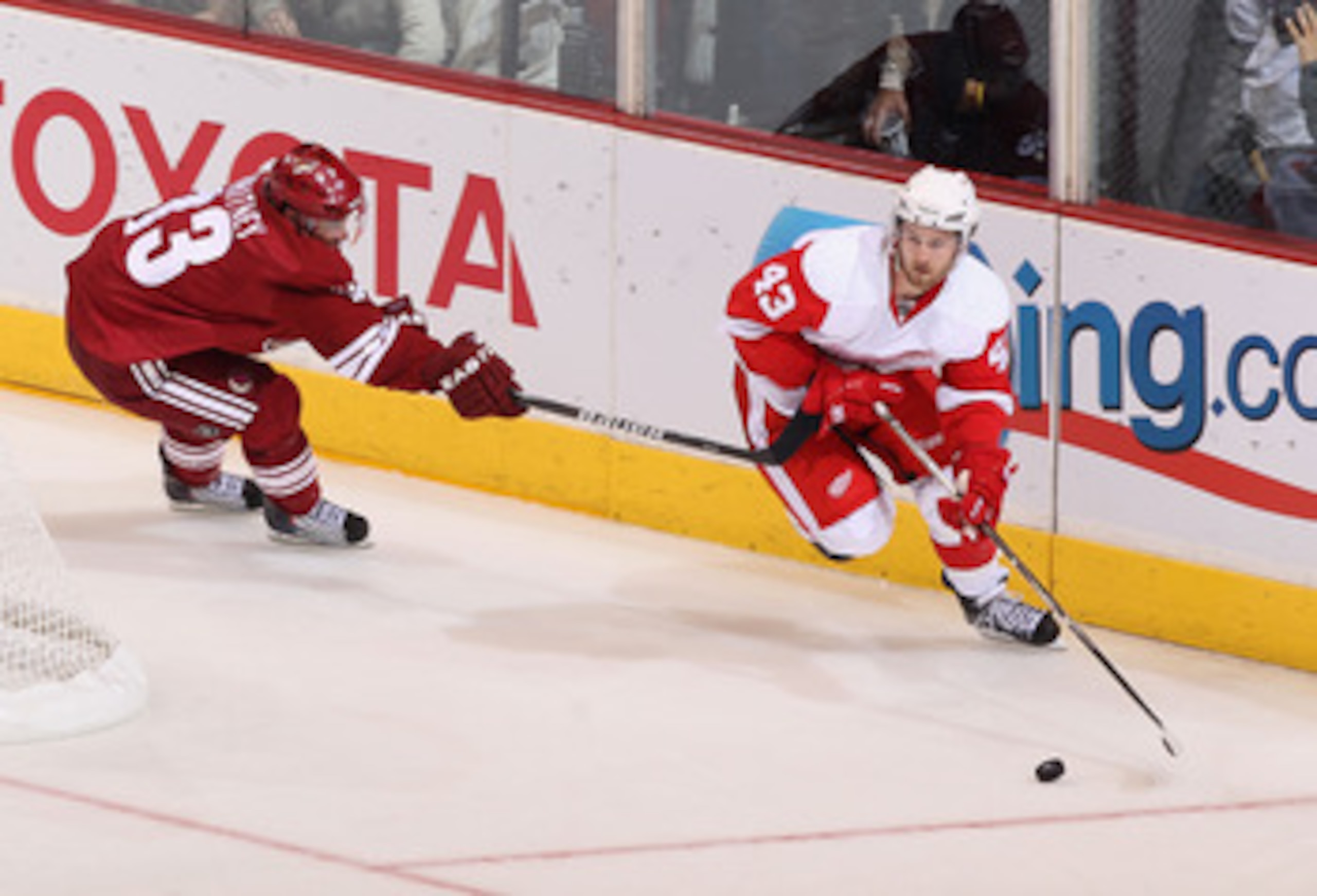 GLENDALE, AZ - APRIL 20: Darren Helm #43 of the Detroit Red Wings skates with the puck past Ray Whitney #13 of the Phoenix Coyotes in Game Four of the Western Conference Quarterfinals during the 2011 NHL Stanley Cup Playoffs at Jobing.com Arena on April GLENDALE, AZ - APRIL 20: Darren Helm #43 of the Detroit Red Wings skates with the puck past Ray Whitney #13 of the Phoenix Coyotes in Game Four of the Western Conference Quarterfinals during the 2011 NHL Stanley Cup Playoffs at Jobing.com Arena on April