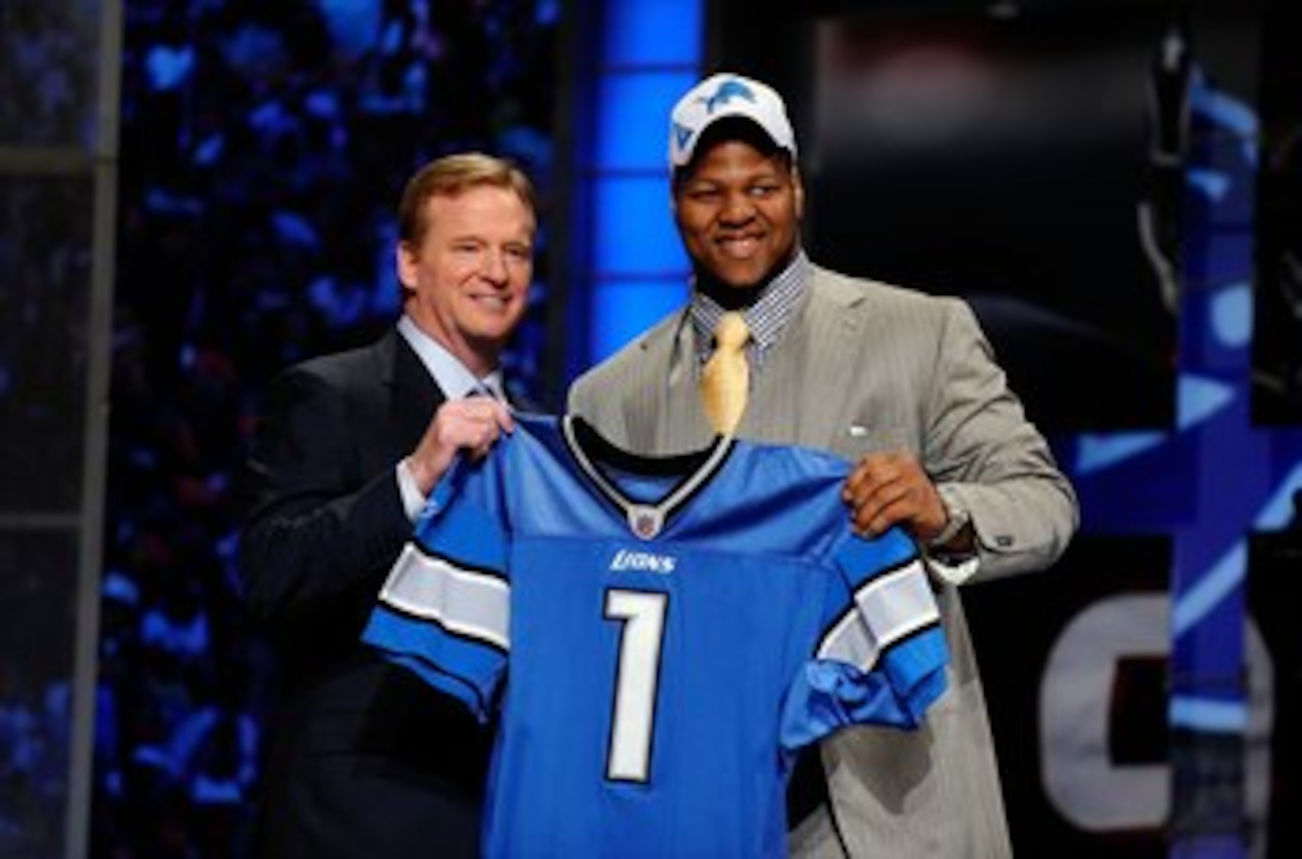 NEW YORK - APRIL 22:  Ndamukong Suh (R) from the Nebraska Cornhuskers poses with NFL Commissioner Roger Goodell as they hold up a Detroit Lions jersey after Suh was selected by the Lions number 2 overall during the first round of the 2010 NFL Draft at Rad