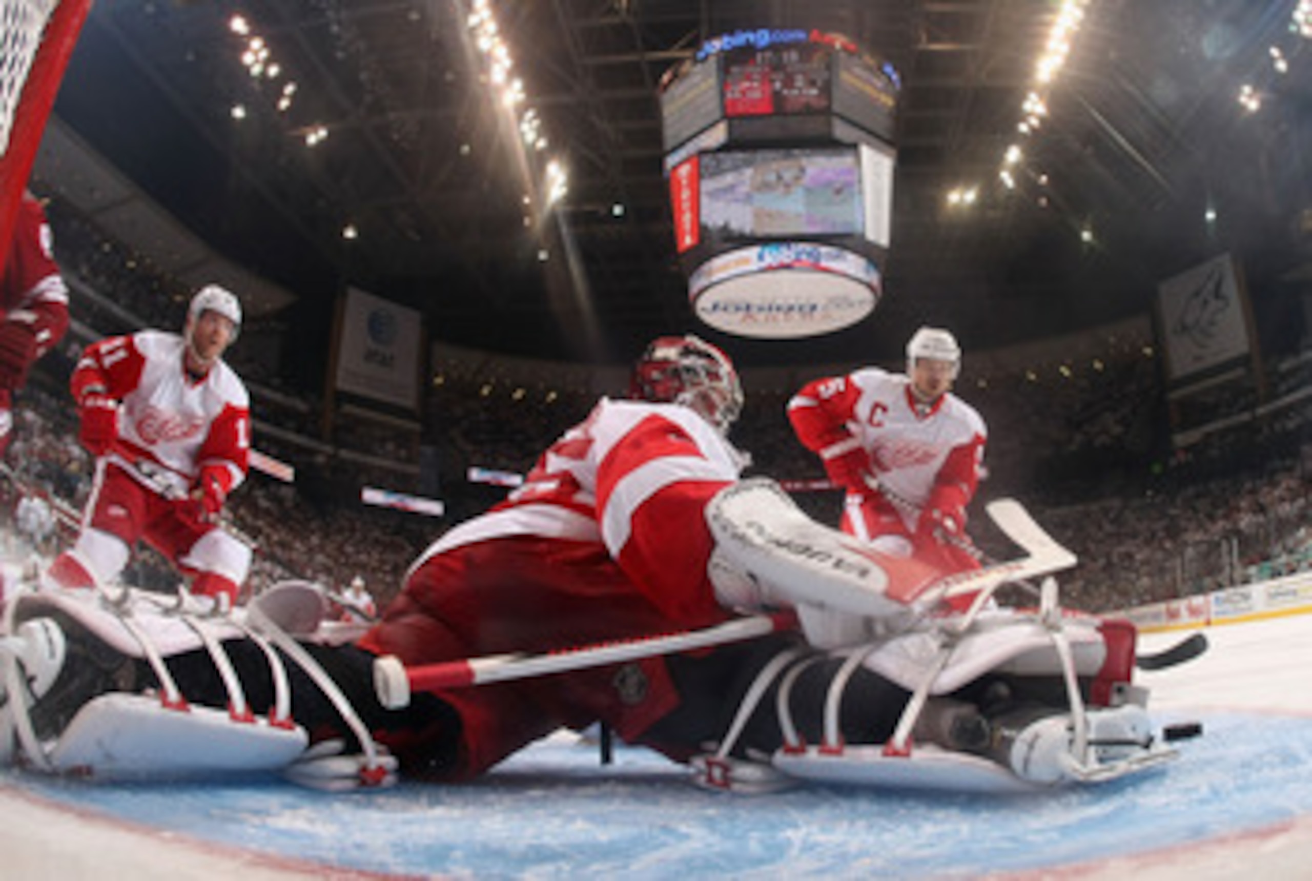 GLENDALE, AZ - APRIL 20: Goaltender Jimmy Howard #35 of the Detroit Red Wings makes a pad save on the shot from the Phoenix Coyotes in Game Four of the Western Conference Quarterfinals during the 2011 NHL Stanley Cup Playoffs at Jobing.com Arena on April GLENDALE, AZ - APRIL 20: Goaltender Jimmy Howard #35 of the Detroit Red Wings makes a pad save on the shot from the Phoenix Coyotes in Game Four of the Western Conference Quarterfinals during the 2011 NHL Stanley Cup Playoffs at Jobing.com Arena on April