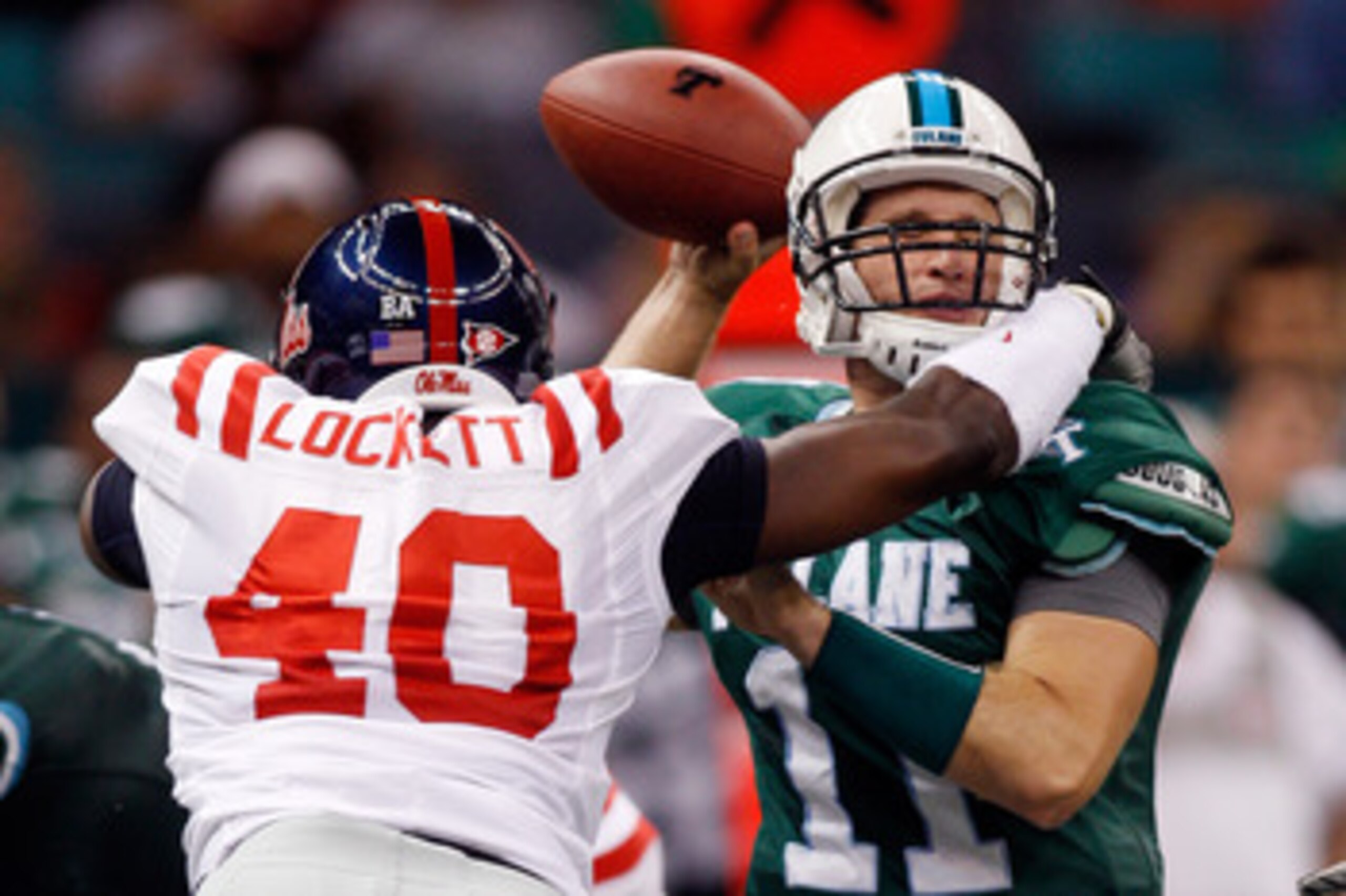 NEW ORLEANS - SEPTEMBER 11:  Ryan Griffin #11 of the Tulane Green Wave is tackled by Kentrell Lockett #40 of the Ole Miss Rebels at the Louisiana Superdome on September 11, 2010 in New Orleans, Louisiana.  (Photo by Chris Graythen/Getty Images)
