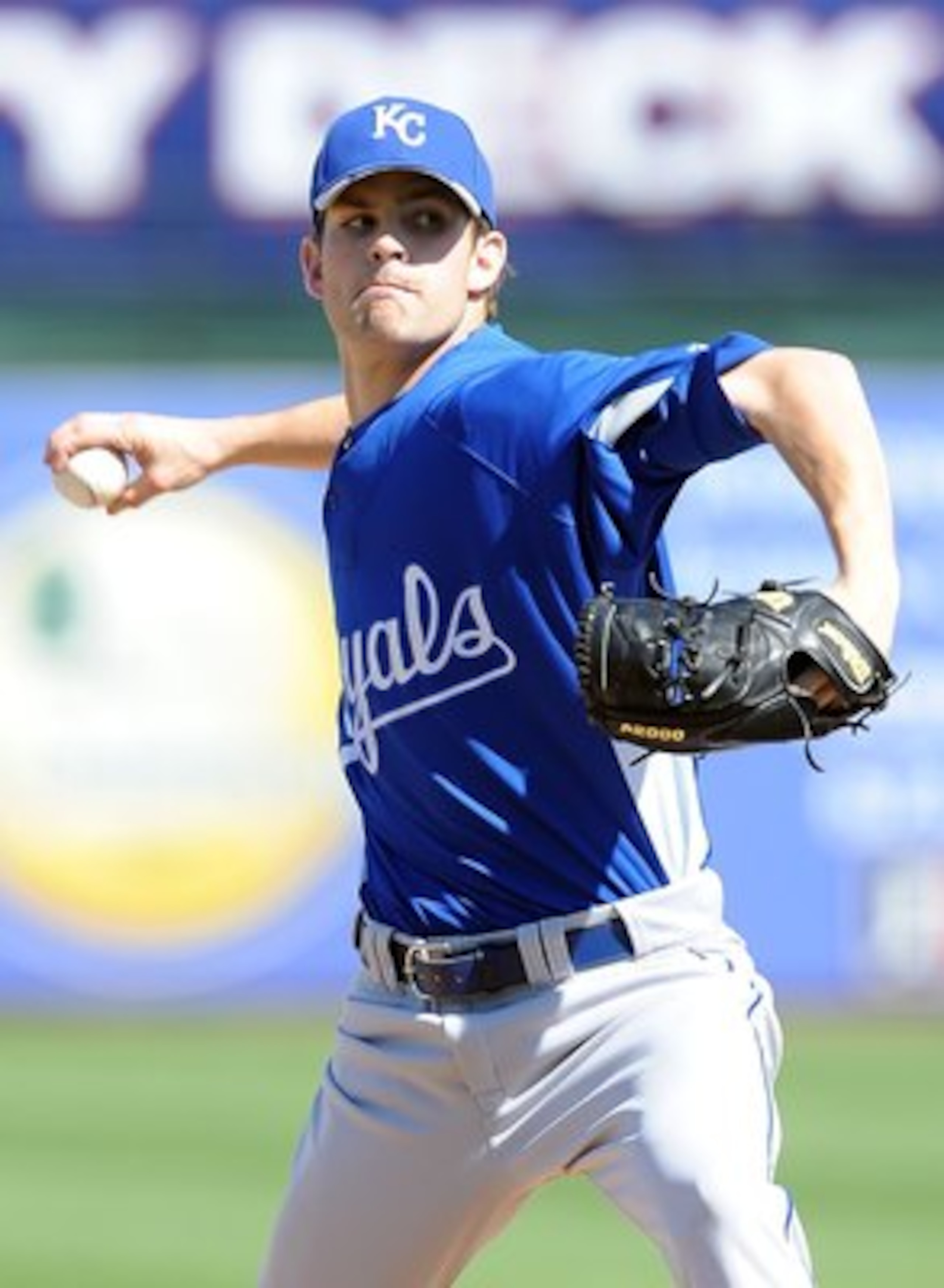 SURPRISE, AZ - MARCH 06:  Aaron Crow #43 of the Kansas City Royals pitches during a Spring Training game against the Texas Rangers on March 6, 2010 in Surprise, Arizona.  (Photo by Lisa Blumenfeld/Getty Images)