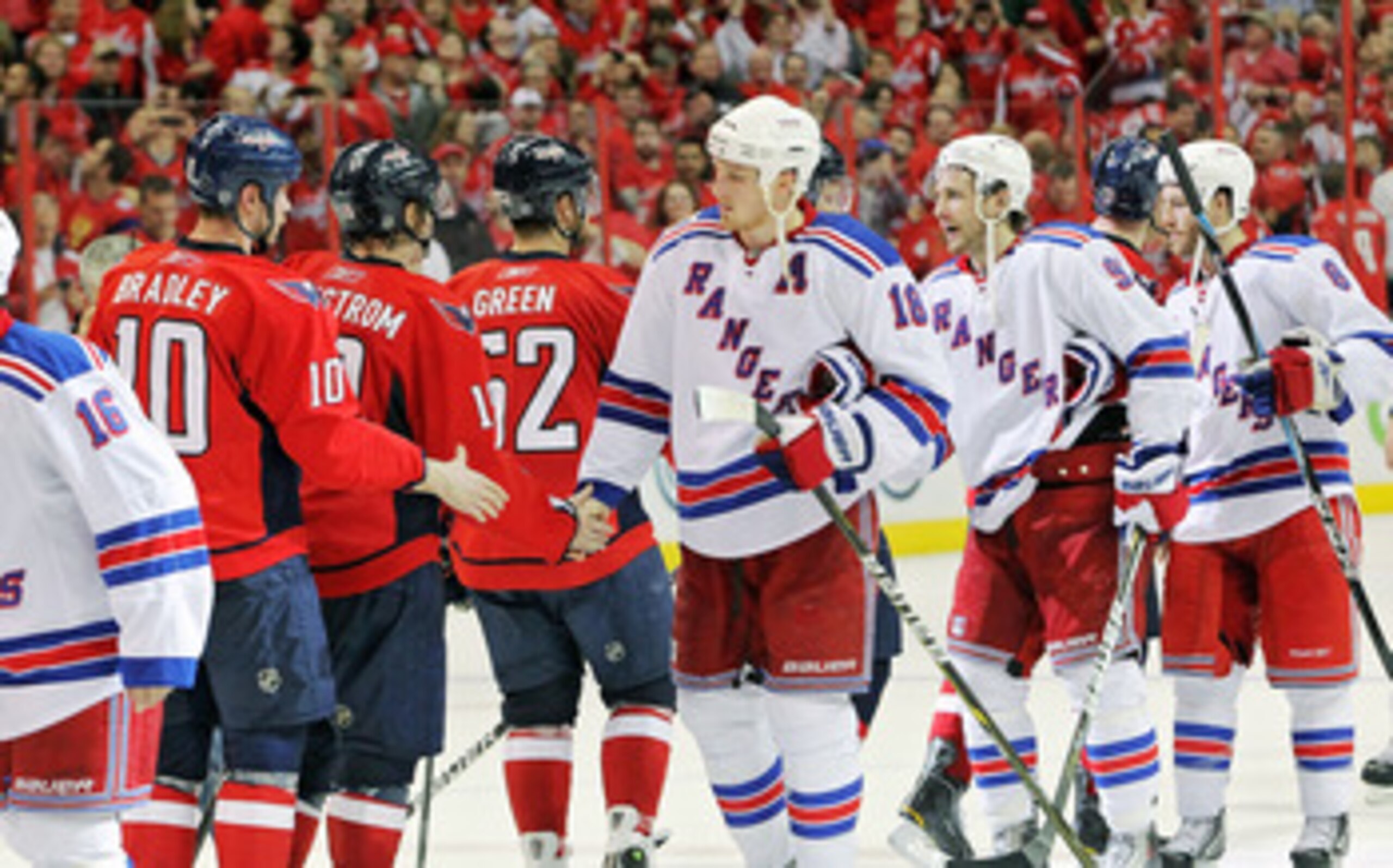 WASHINGTON , DC - APRIL 23:  Nicklas Backstrom #19 of the Washington Capitals greets Marc Staal #18 of the New York Rangers during the handshake following a 3-1 win over the Rangers in Game Five of the Eastern Conference Quarterfinals during the 2011 NHL 