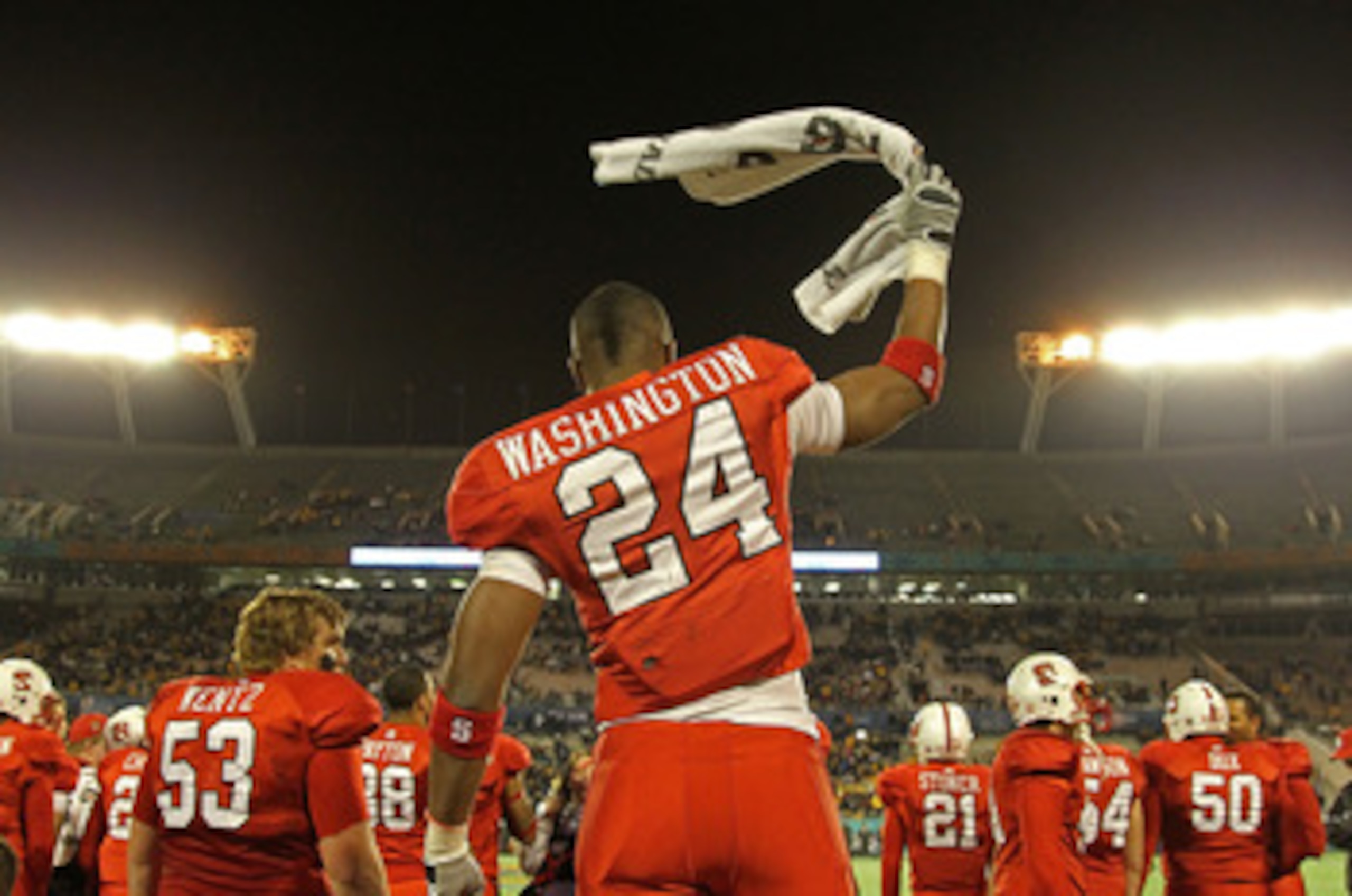 ORLANDO, FL - DECEMBER 28:  James Washington #24 of the North Carolina State Wolfpack celebrates after winning  the Champs Sports Bowl against the West Virginia Mountineers at Florida Citrus Bowl Stadium on December 28, 2010 in Orlando, Florida.  (Photo b