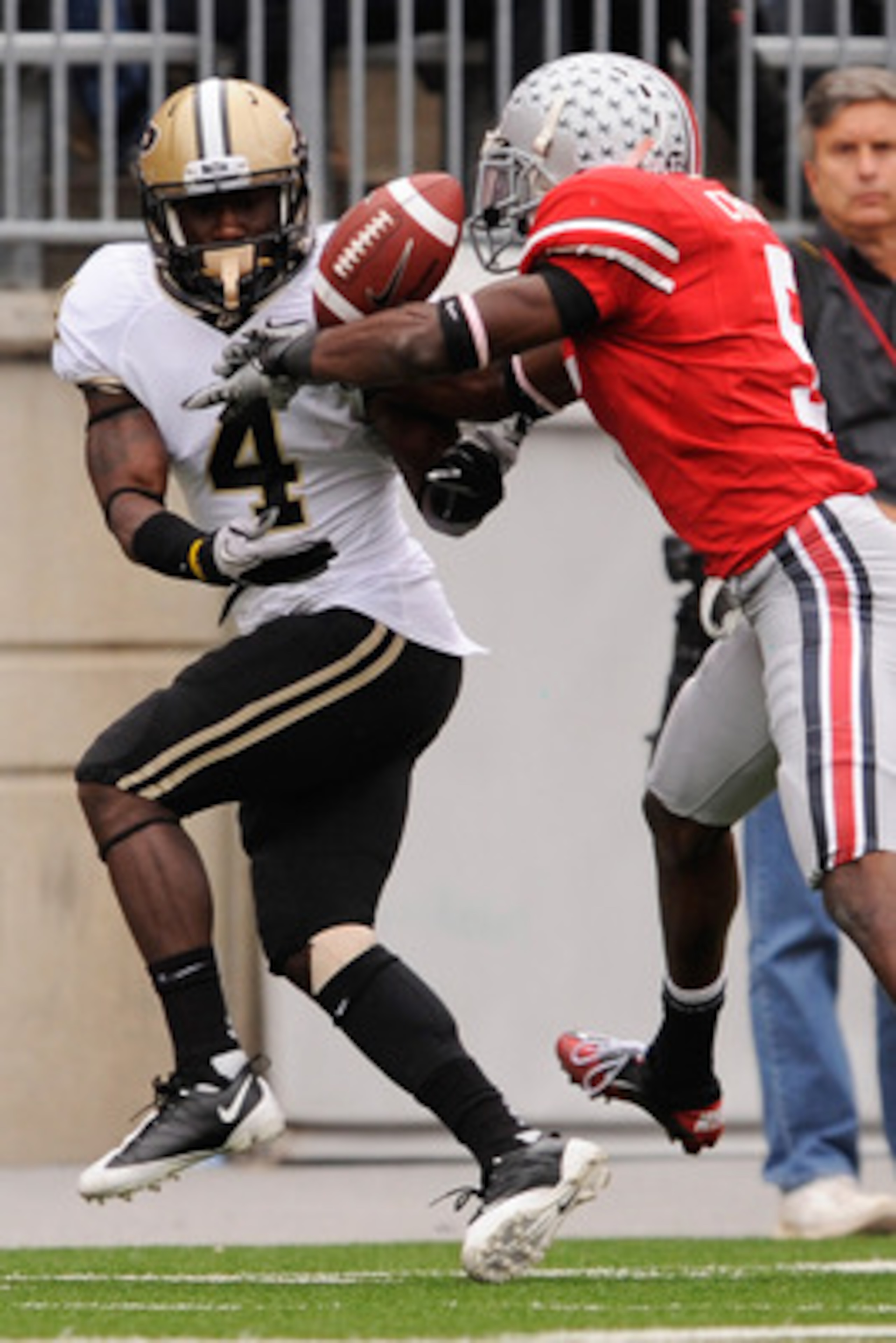COLUMBUS, OH - OCTOBER 23:  Chimdi Chekwa #5 of the Ohio State Buckeyes breaks up a pass intended for O.J. Ross #4 of the Purdue Boilermakers at Ohio Stadium on October 23, 2010 in Columbus, Ohio.  (Photo by Jamie Sabau/Getty Images)