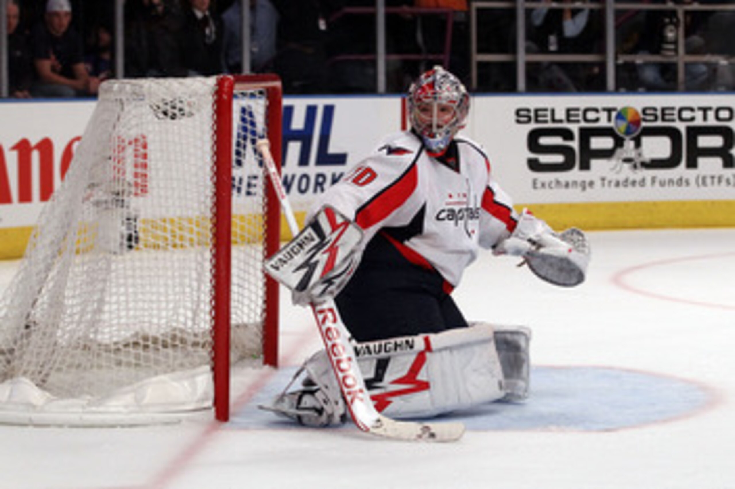 NEW YORK, NY - APRIL 20:  Goalie Michal Neuvirth #30 of the Washington Capitals looks back to the corner for the puck against the New York Rangers in Game Four of the Eastern Conference Quarterfinals during the 2011 NHL Stanley Cup Playoffs at Madison Squ
