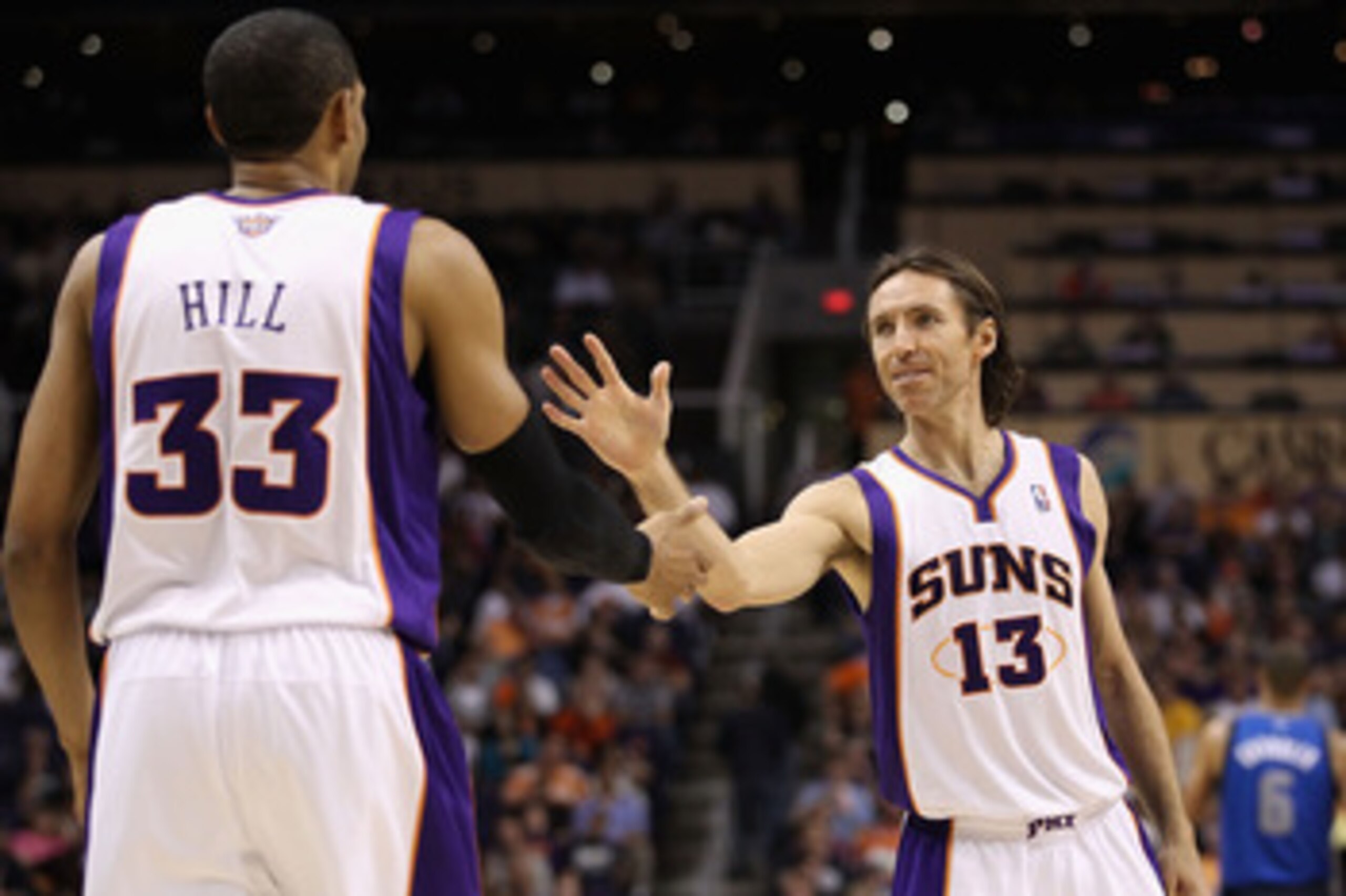 PHOENIX, AZ - MARCH 27: Steve Nash #13 of the Phoenix Suns high fives teammate Grant Hill #33 during the NBA game against the Dallas Mavericks at US Airways Center on March 27, 2011 in Phoenix, Arizona. The Mavericks defeated the Suns 91-83. NOTE TO USE PHOENIX, AZ - MARCH 27: Steve Nash #13 of the Phoenix Suns high fives teammate Grant Hill #33 during the NBA game against the Dallas Mavericks at US Airways Center on March 27, 2011 in Phoenix, Arizona. The Mavericks defeated the Suns 91-83. NOTE TO USE