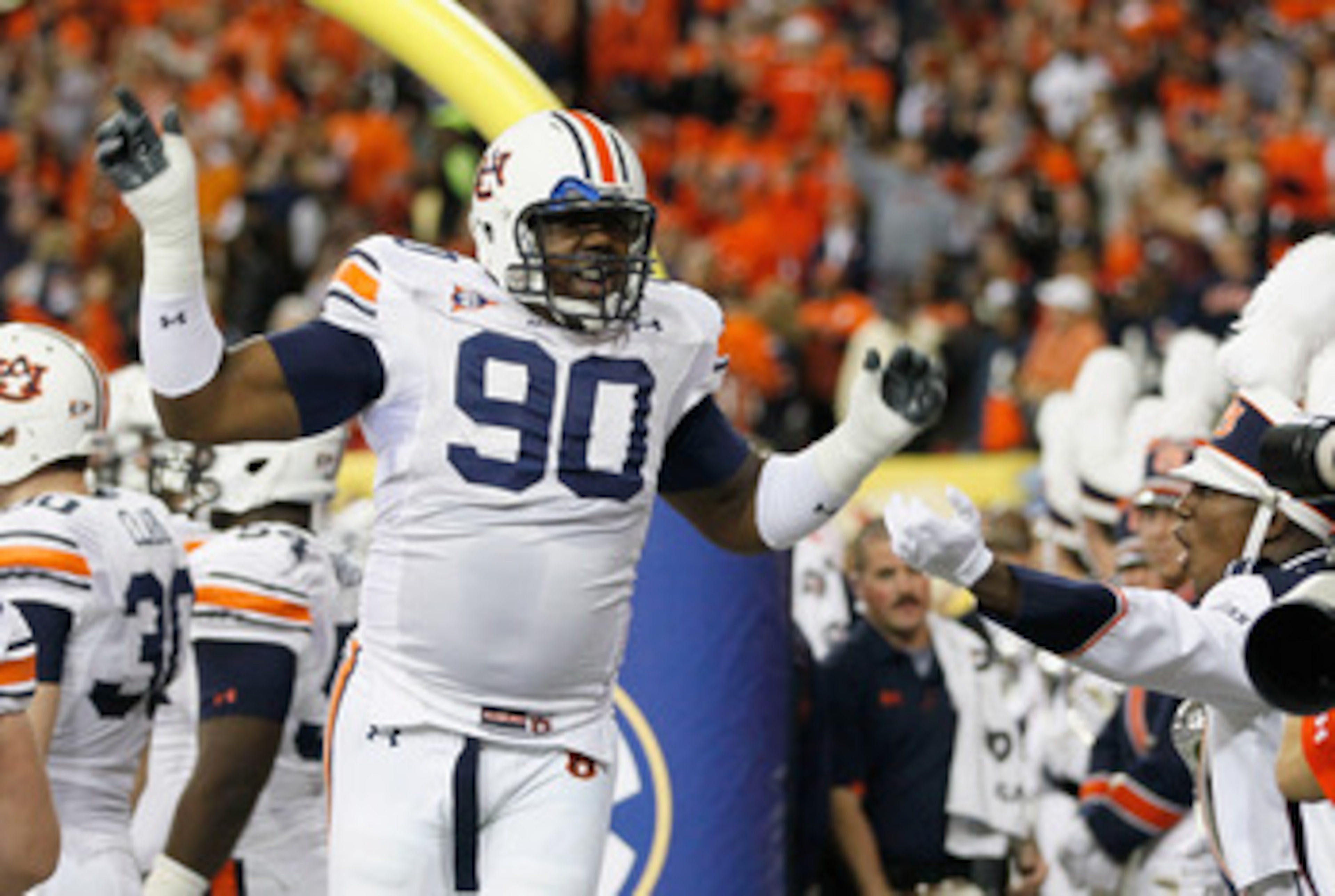 ATLANTA, GA - DECEMBER 04:  Nick Fairley #90 of the Auburn Tigers cheers during pregame warmups before facing the South Carolina Gamecocks during the 2010 SEC Championship at Georgia Dome on December 4, 2010 in Atlanta, Georgia.  (Photo by Kevin C. Cox/Ge
