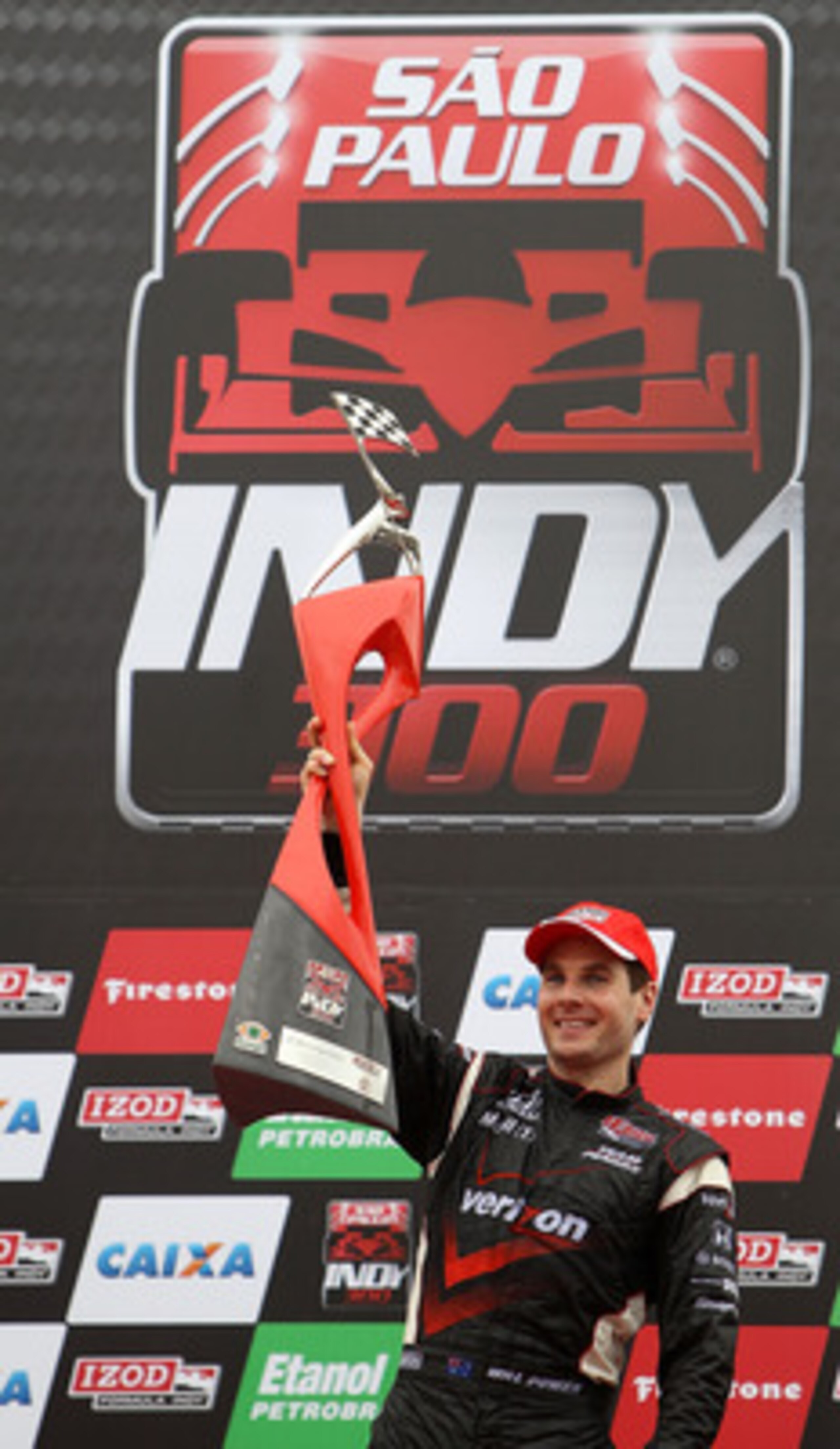 SAO PAULO, BRAZIL - MARCH 14:  Will Power of Australia, driver of the #12 Verizon Team Penske Dallara Honda, celebrates after winning the IRL IndyCar Series Sao Paulo Indy 300 on March 14, 2010 in Sao Paulo, Brazil.  (Photo by Streeter Lecka/Getty Images)