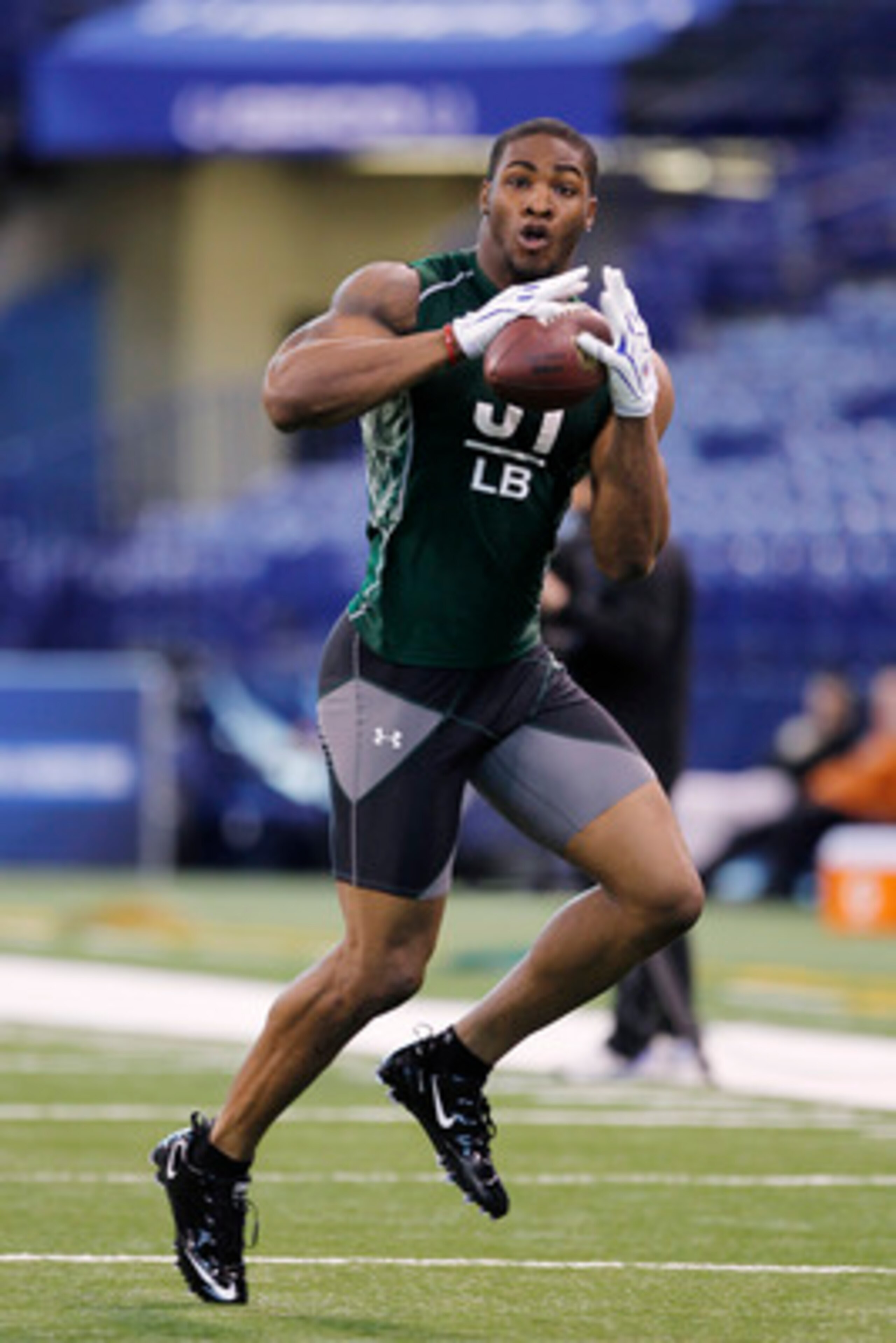 INDIANAPOLIS, IN - FEBRUARY 28: Martez Wilson of Illinois works out during the 2011 NFL Scouting Combine at Lucas Oil Stadium on February 28, 2011 in Indianapolis, Indiana. (Photo by Joe Robbins/Getty Images)