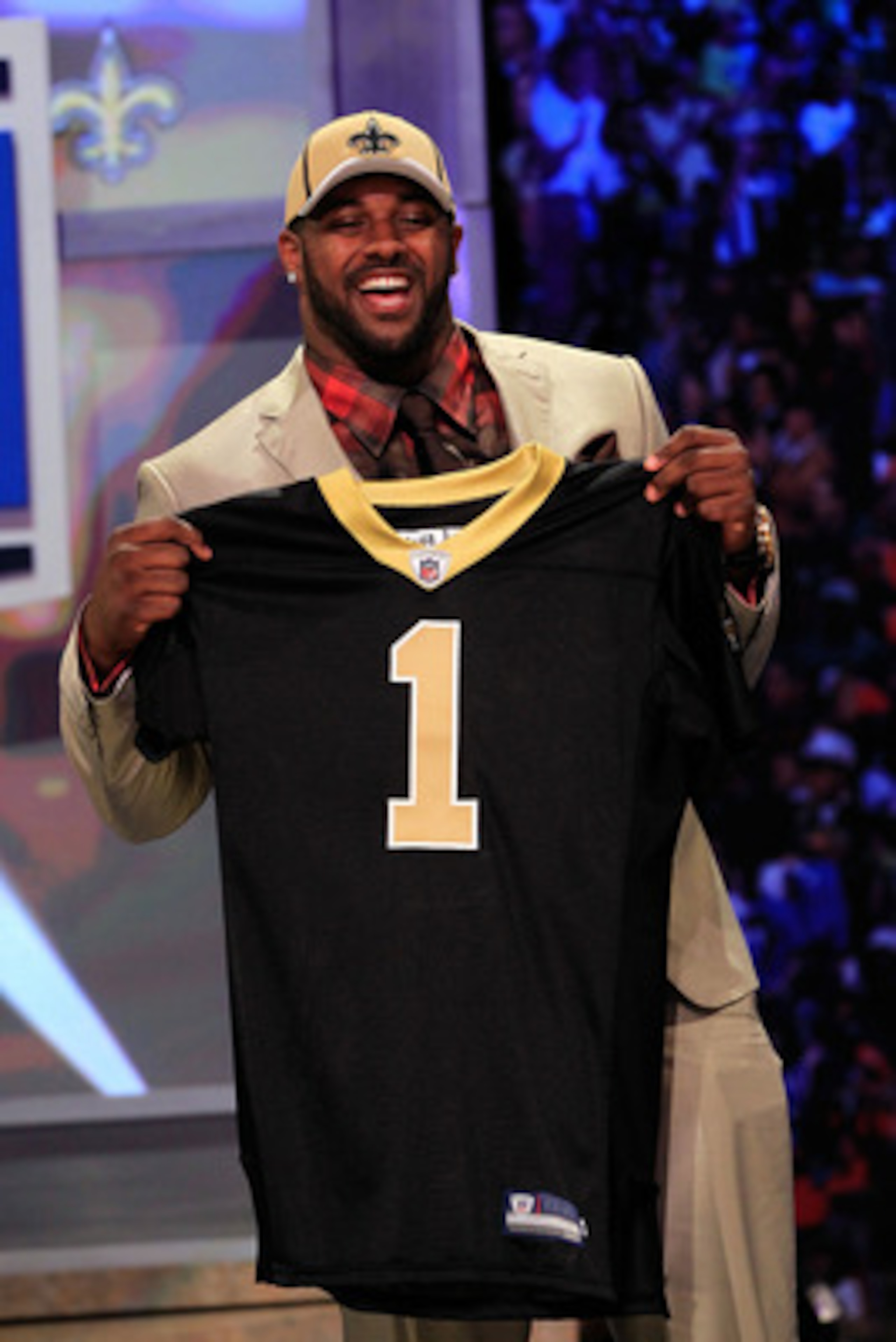 NEW YORK, NY - APRIL 28:  Cameron Jordan, #24 overall pick by the New Orleans Saints, holds up a jersey on stage during the 2011 NFL Draft at Radio City Music Hall on April 28, 2011 in New York City.  (Photo by Chris Trotman/Getty Images)