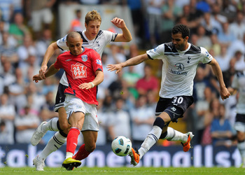 LONDON, ENGLAND - APRIL 23: Raniere Sandro and Michael Dawson of Spurs close down Peter Odemwingie of West Brom during the Barclays Premier League match between Tottenham Hotspur and West Bromwich Albion at White Hart Lane on April 23, 2011 in London, Eng