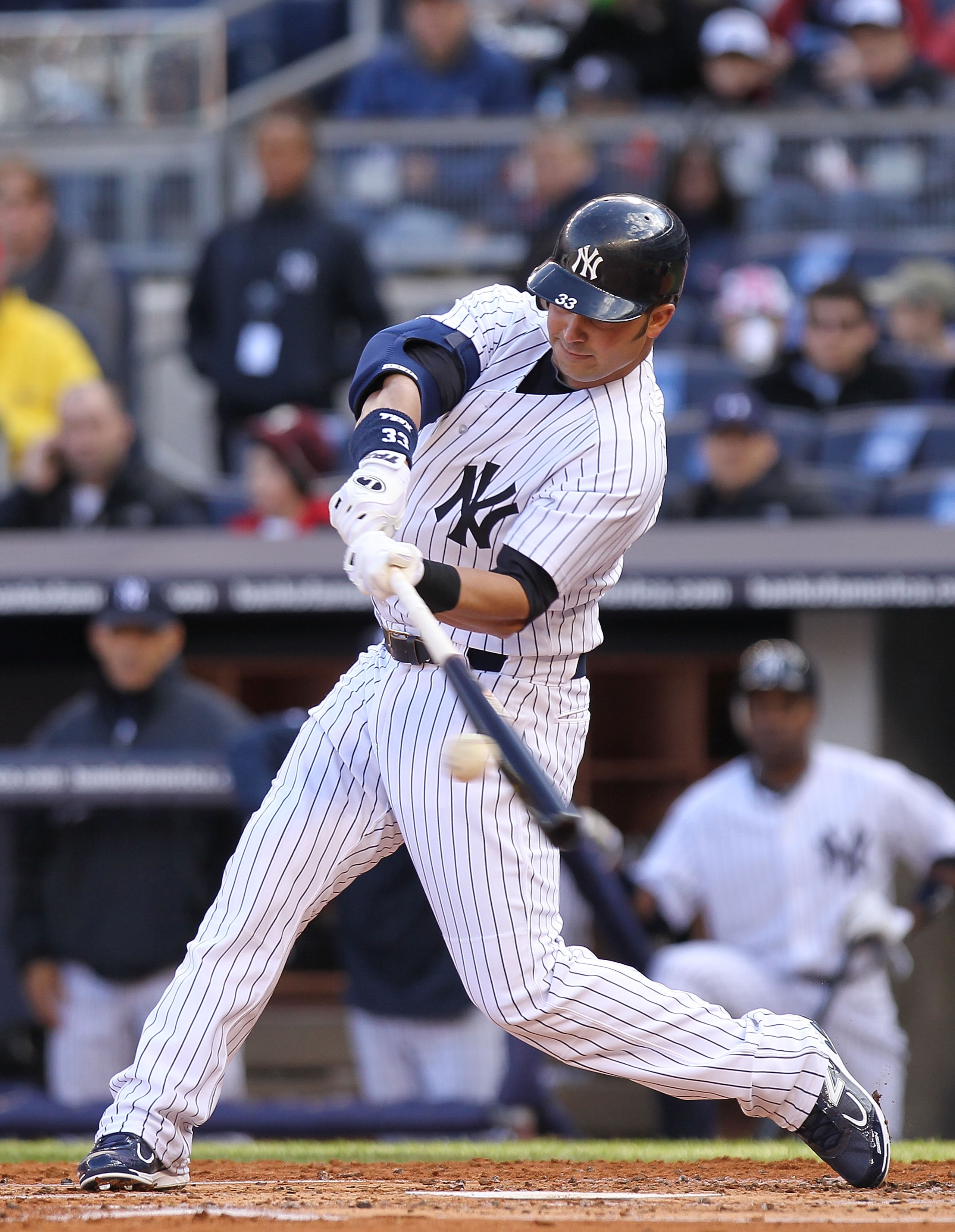 NEW YORK, NY - APRIL 02: Nick Swisher #33 of the New York Yankees hits a RBI sacrifice fly to score the run of Alex Rodriguez #13 against the Detroit Tigers at Yankee Stadium on April 2, 2011 in the Bronx borough of New York City. (Photo by Nick Laham/G NEW YORK, NY - APRIL 02: Nick Swisher #33 of the New York Yankees hits a RBI sacrifice fly to score the run of Alex Rodriguez #13 against the Detroit Tigers at Yankee Stadium on April 2, 2011 in the Bronx borough of New York City. (Photo by Nick Laham/G