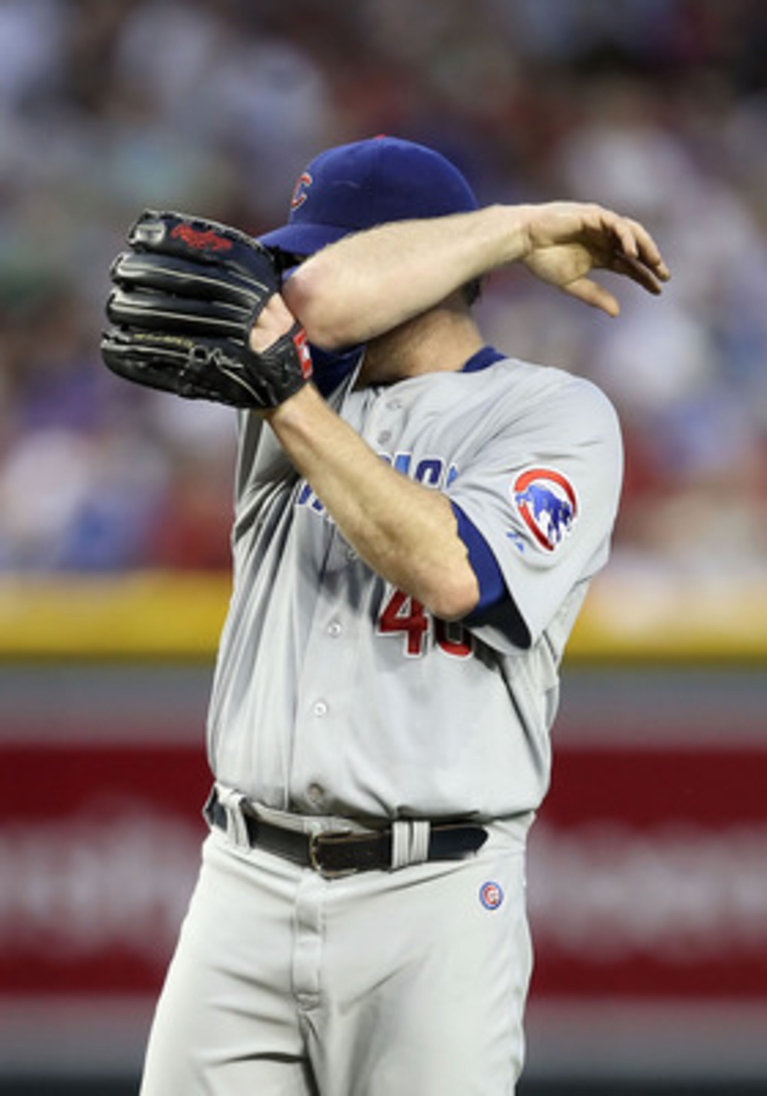 PHOENIX, AZ - APRIL 28:  Starting pitcher Ryan Dempster #46 of the Chicago Cubs reacts on the mound during the first inning of the Major League Baseball game at Chase Field on April 28, 2011 in Phoenix, Arizona.  (Photo by Christian Petersen/Getty Images)