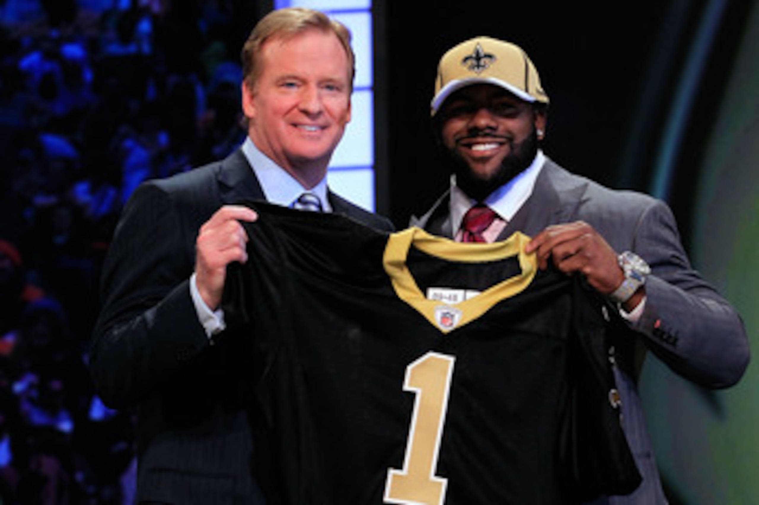 NEW YORK, NY - APRIL 28:  NFL Commissioner Roger Goodell (L) poses for a photo with Mark Ingram, #28 overall pick by the New Orleans Saints, holds up a jersey on stage during the 2011 NFL Draft at Radio City Music Hall on April 28, 2011 in New York City. 