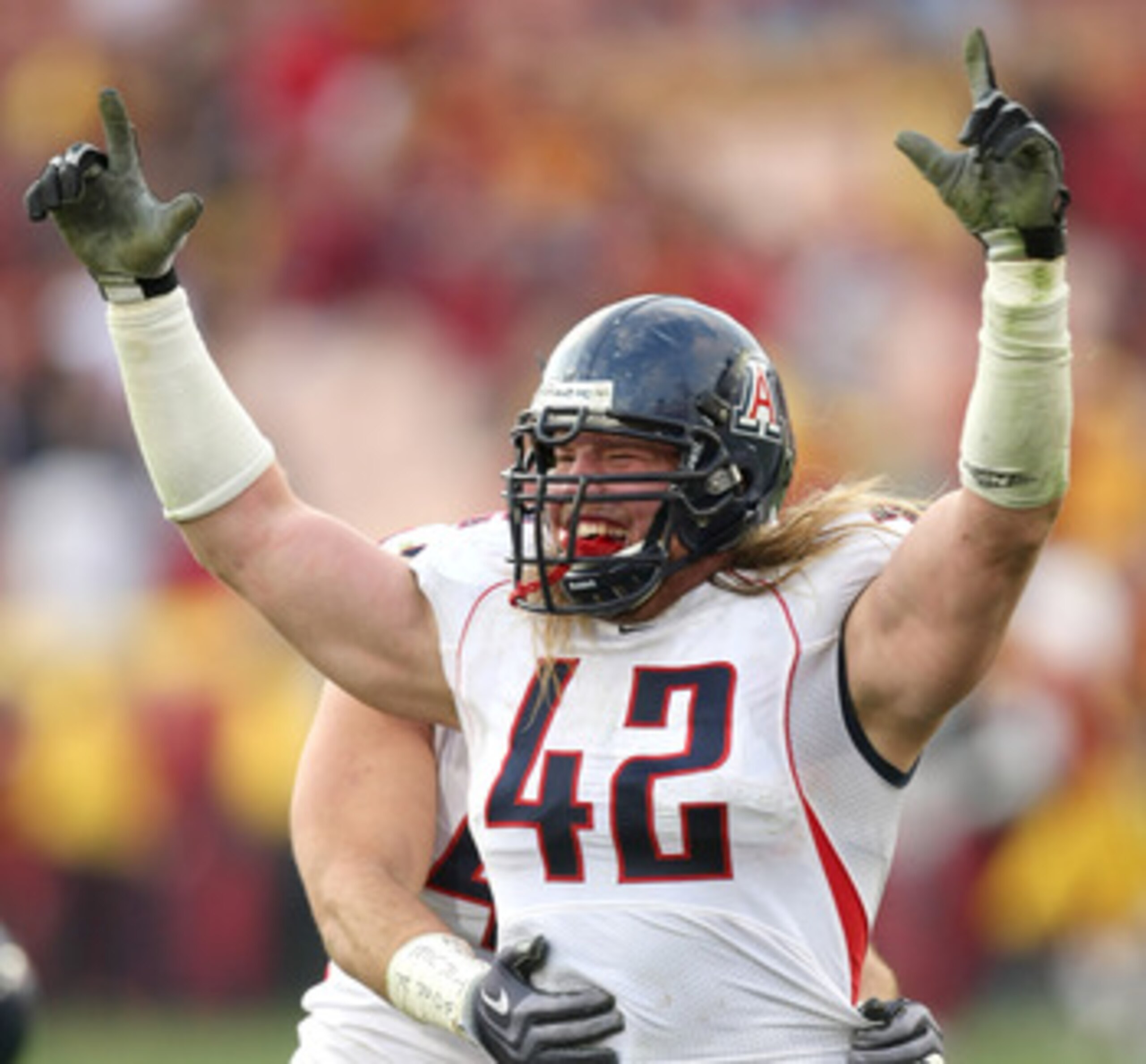 LOS ANGELES, CA - DECEMBER 05:  Defensive end Brooks Reed #42 of the Arizona Wildcats celebrates after stopping the USC Trojans on the final play on December 5, 2009 at the Los Angeles Coliseum in Los Angeles, California. Arizona won 21-17.  (Photo by Ste