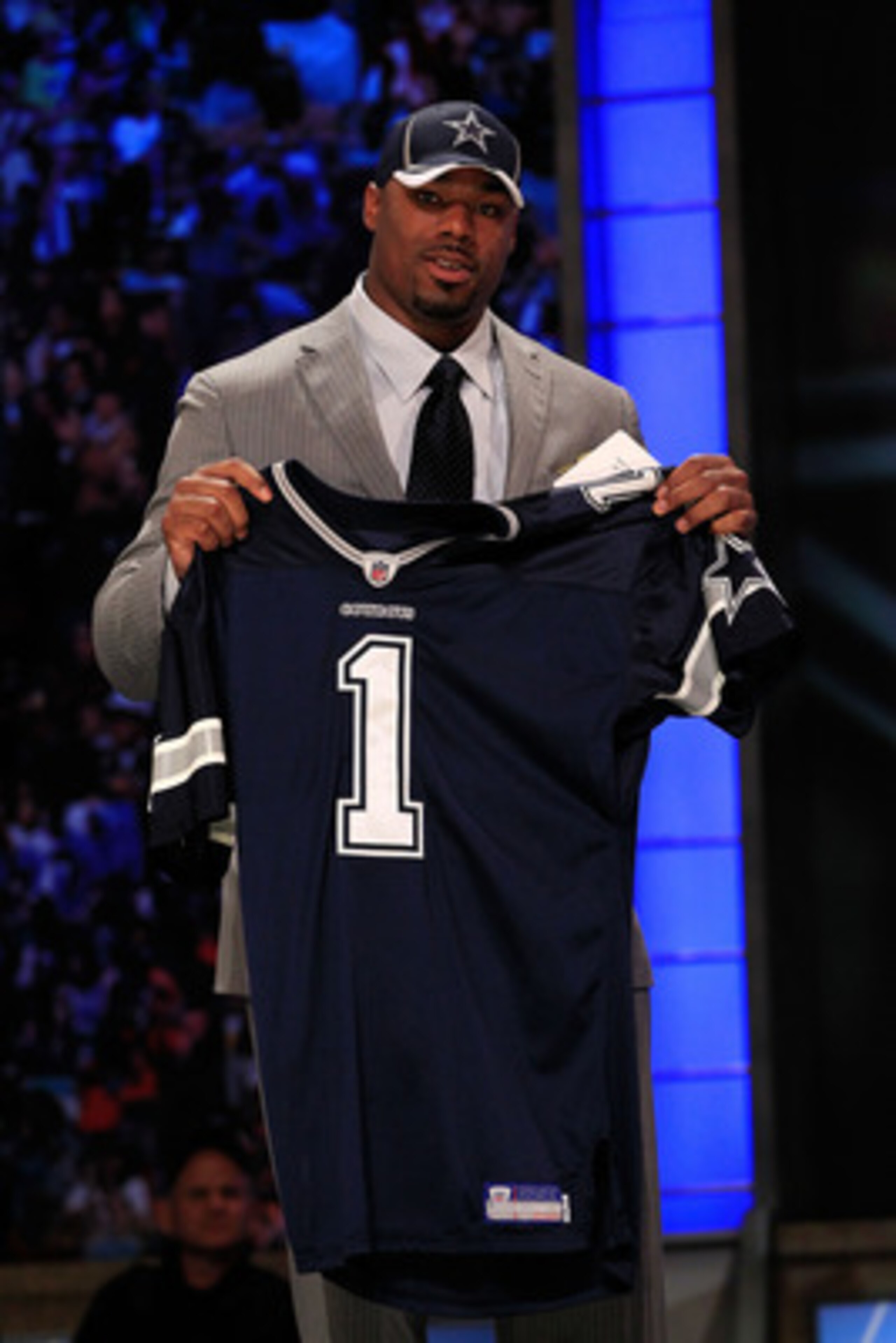 NEW YORK, NY - APRIL 28: Tyron Smith, #9 overall pick by the Dallas Cowboys, holds up a jersey on stage during the 2011 NFL Draft at Radio City Music Hall on April 28, 2011 in New York City. (Photo by Chris Trotman/Getty Images) NEW YORK, NY - APRIL 28: Tyron Smith, #9 overall pick by the Dallas Cowboys, holds up a jersey on stage during the 2011 NFL Draft at Radio City Music Hall on April 28, 2011 in New York City. (Photo by Chris Trotman/Getty Images)