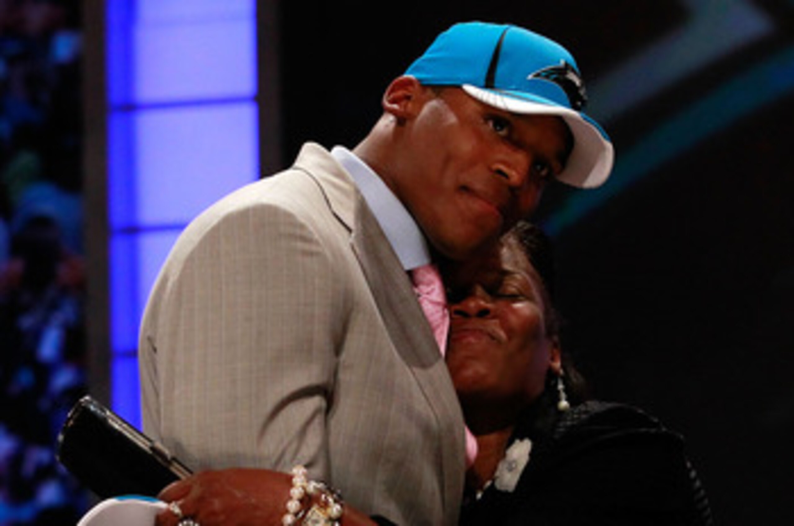 NEW YORK, NY - APRIL 28: Cam Newton receives a hug from his mother Jackie on stage after he was selected #1 overall by the Carolina Panthers during the 2011 NFL Draft at Radio City Music Hall on April 28, 2011 in New York City. (Photo by Chris Trotman/G NEW YORK, NY - APRIL 28: Cam Newton receives a hug from his mother Jackie on stage after he was selected #1 overall by the Carolina Panthers during the 2011 NFL Draft at Radio City Music Hall on April 28, 2011 in New York City. (Photo by Chris Trotman/G
