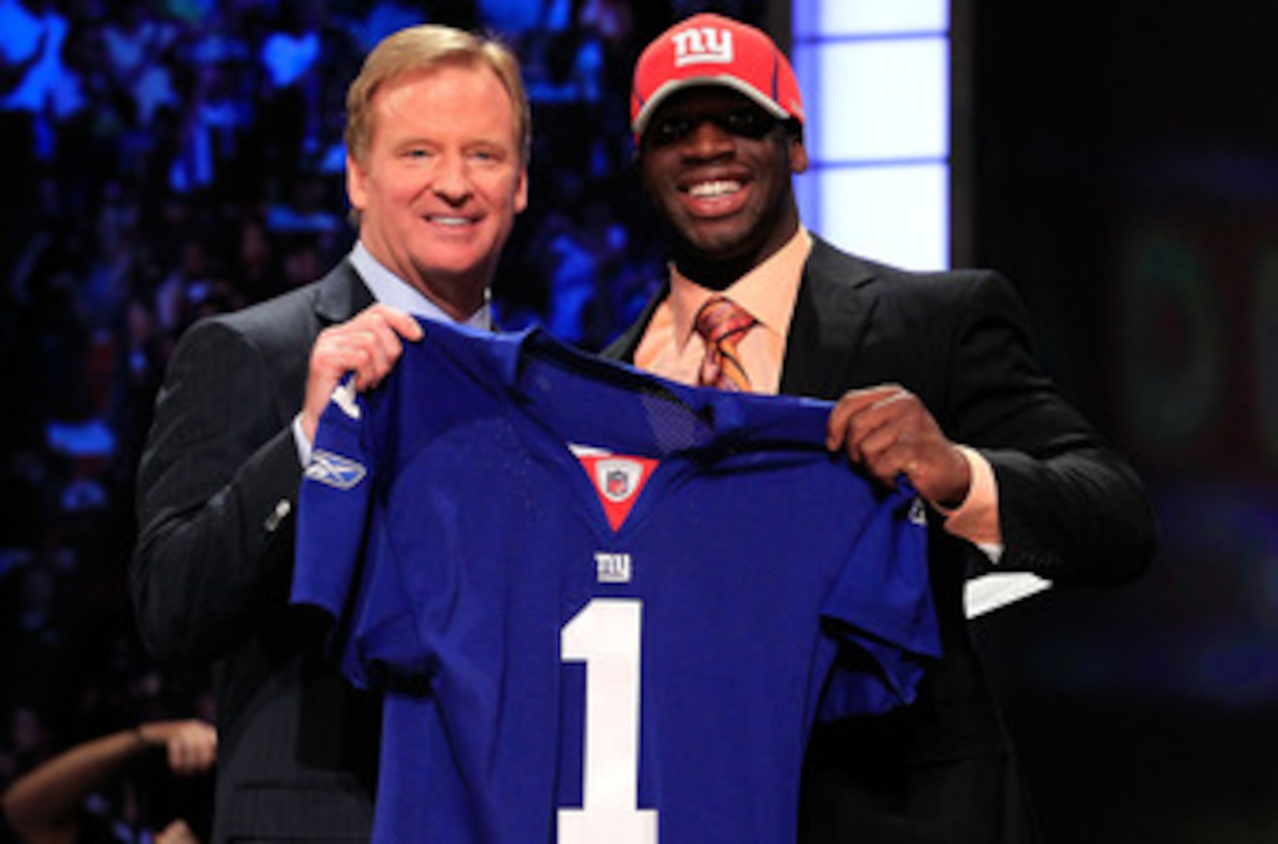 NEW YORK, NY - APRIL 28:  NFL Commissioner Roger Goodell (L) poses for a photo with Prince Amukamara, #19 overall pick by the New York Giants, on stage during the 2011 NFL Draft at Radio City Music Hall on April 28, 2011 in New York City.  (Photo by Chris