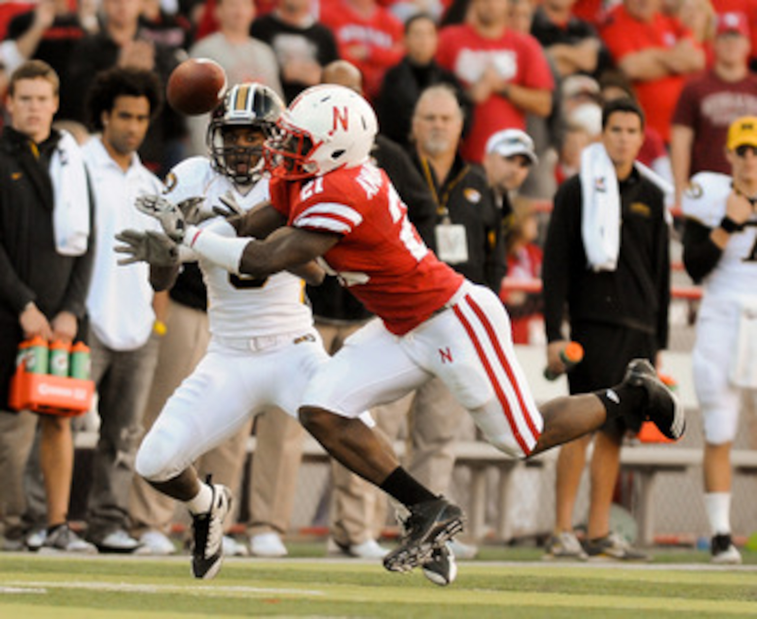 LINCOLN, NE - OCTOBER 30: Cornerback Prince Amukamara #21 of the Nebraska Cornhuskers breaks up a pass intended wide receiver Wes Kemp #8 of the during second half action of their game at Memorial Stadium on October 30, 2010 in Lincoln, Nebraska. Nebraska