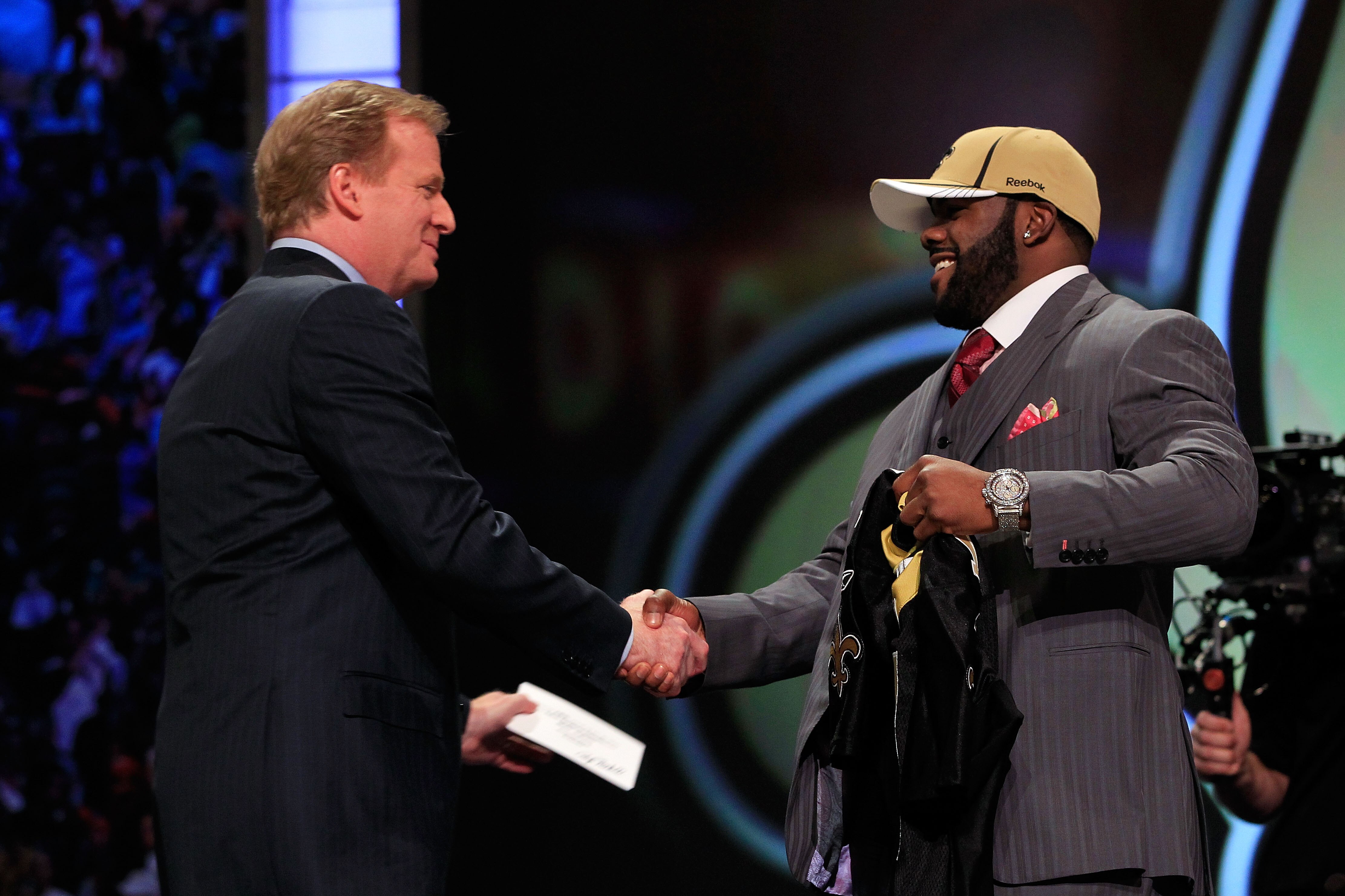 NEW YORK, NY - APRIL 28:  NFL Commissioner Roger Goodell (L) greets Mark Ingram, #28 overall pick by the New Orleans Saints, on stage during the 2011 NFL Draft at Radio City Music Hall on April 28, 2011 in New York City.  (Photo by Chris Trotman/Getty Ima