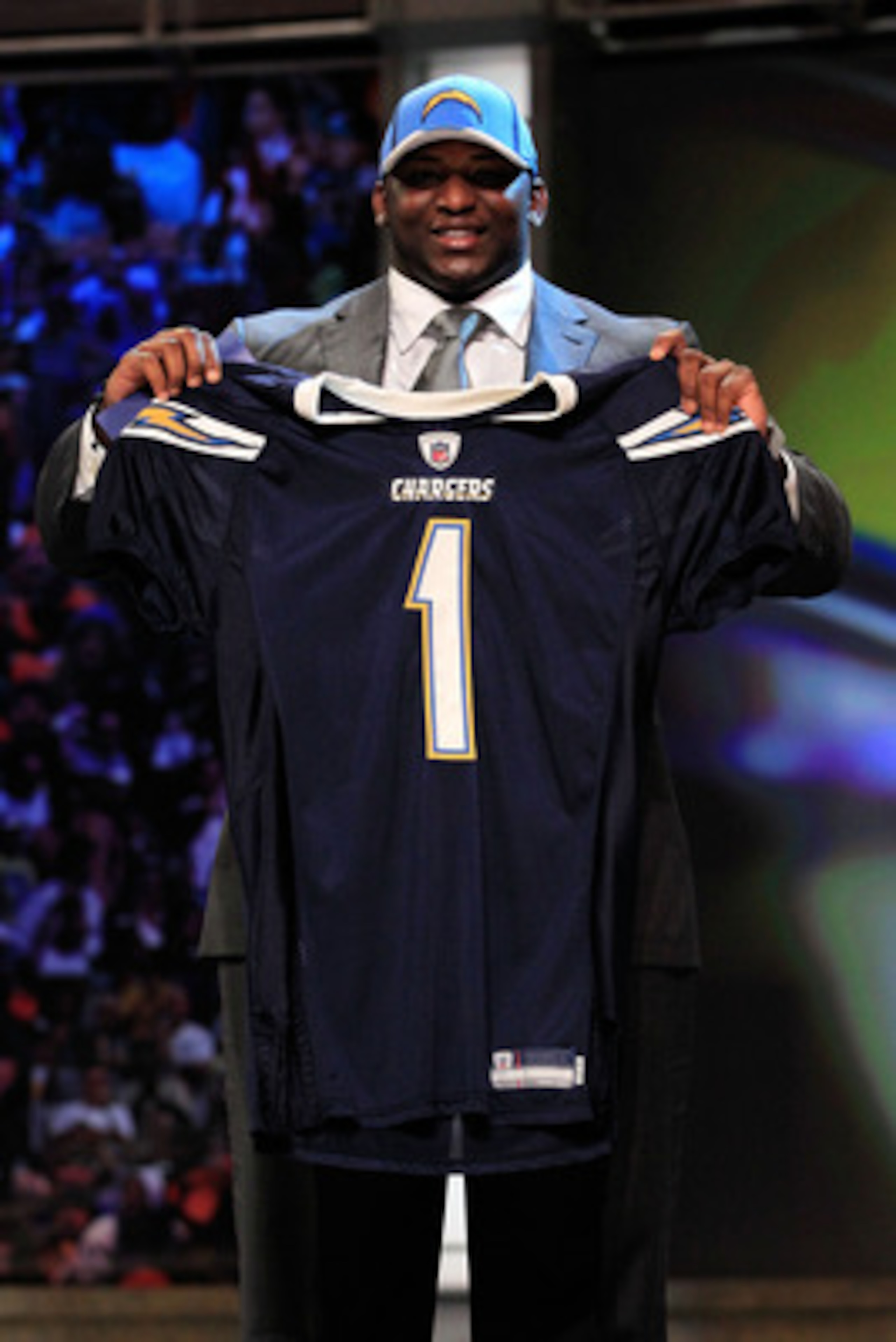 NEW YORK, NY - APRIL 28:  Corey Liuget, #18 overall pick by the San Diego Chargers, holds up a jersey on stage during the 2011 NFL Draft at Radio City Music Hall on April 28, 2011 in New York City.  (Photo by Chris Trotman/Getty Images)