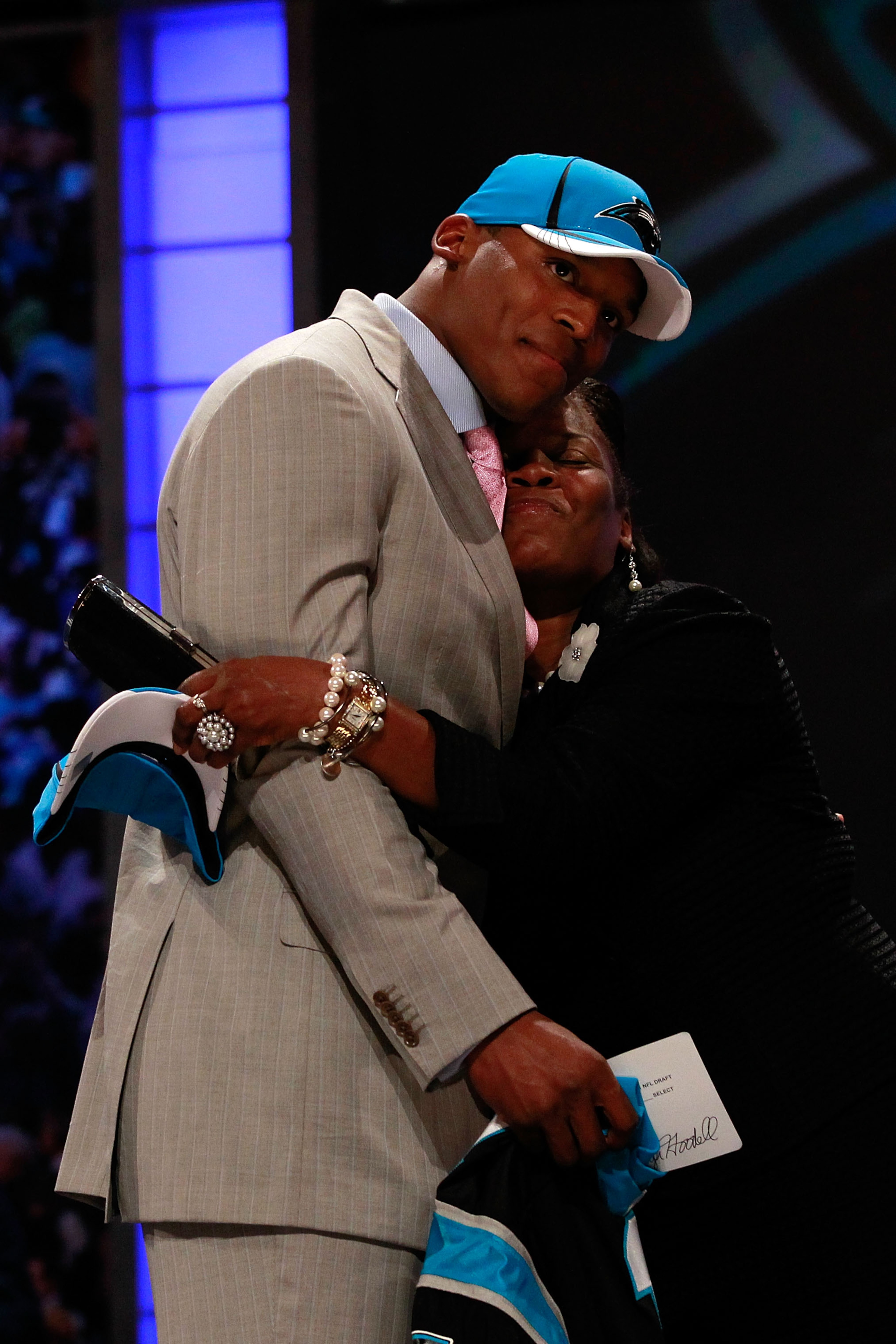 NEW YORK, NY - APRIL 28: Cam Newton receives a hug from his mother Jackie on stage after he was selected #1 overall by the Carolina Panthers during the 2011 NFL Draft at Radio City Music Hall on April 28, 2011 in New York City. (Photo by Chris Trotman/G NEW YORK, NY - APRIL 28: Cam Newton receives a hug from his mother Jackie on stage after he was selected #1 overall by the Carolina Panthers during the 2011 NFL Draft at Radio City Music Hall on April 28, 2011 in New York City. (Photo by Chris Trotman/G