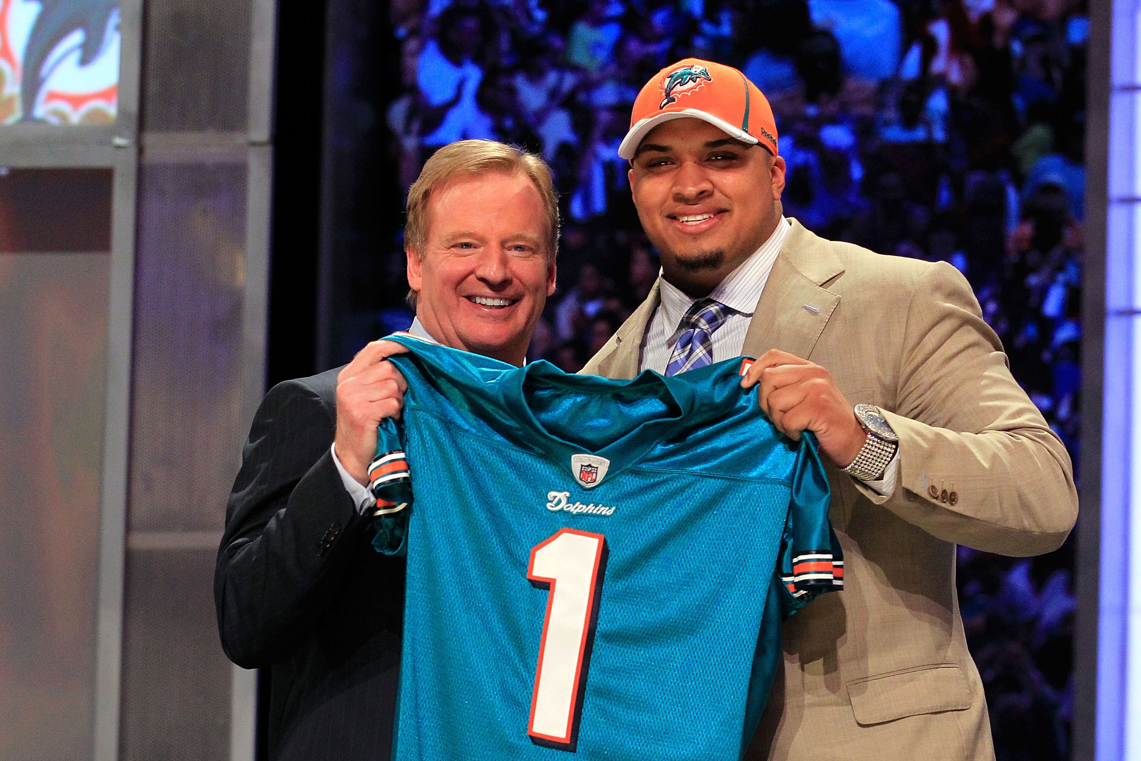 NEW YORK, NY - APRIL 28: NFL Commissioner Roger Goodell poses for a photo with Mike Pouncey, #15 overall pick by the Miami Dolphins, on stage during the 2011 NFL Draft at Radio City Music Hall on April 28, 2011 in New York City. (Photo by Chris Trotman/ NEW YORK, NY - APRIL 28: NFL Commissioner Roger Goodell poses for a photo with Mike Pouncey, #15 overall pick by the Miami Dolphins, on stage during the 2011 NFL Draft at Radio City Music Hall on April 28, 2011 in New York City. (Photo by Chris Trotman/