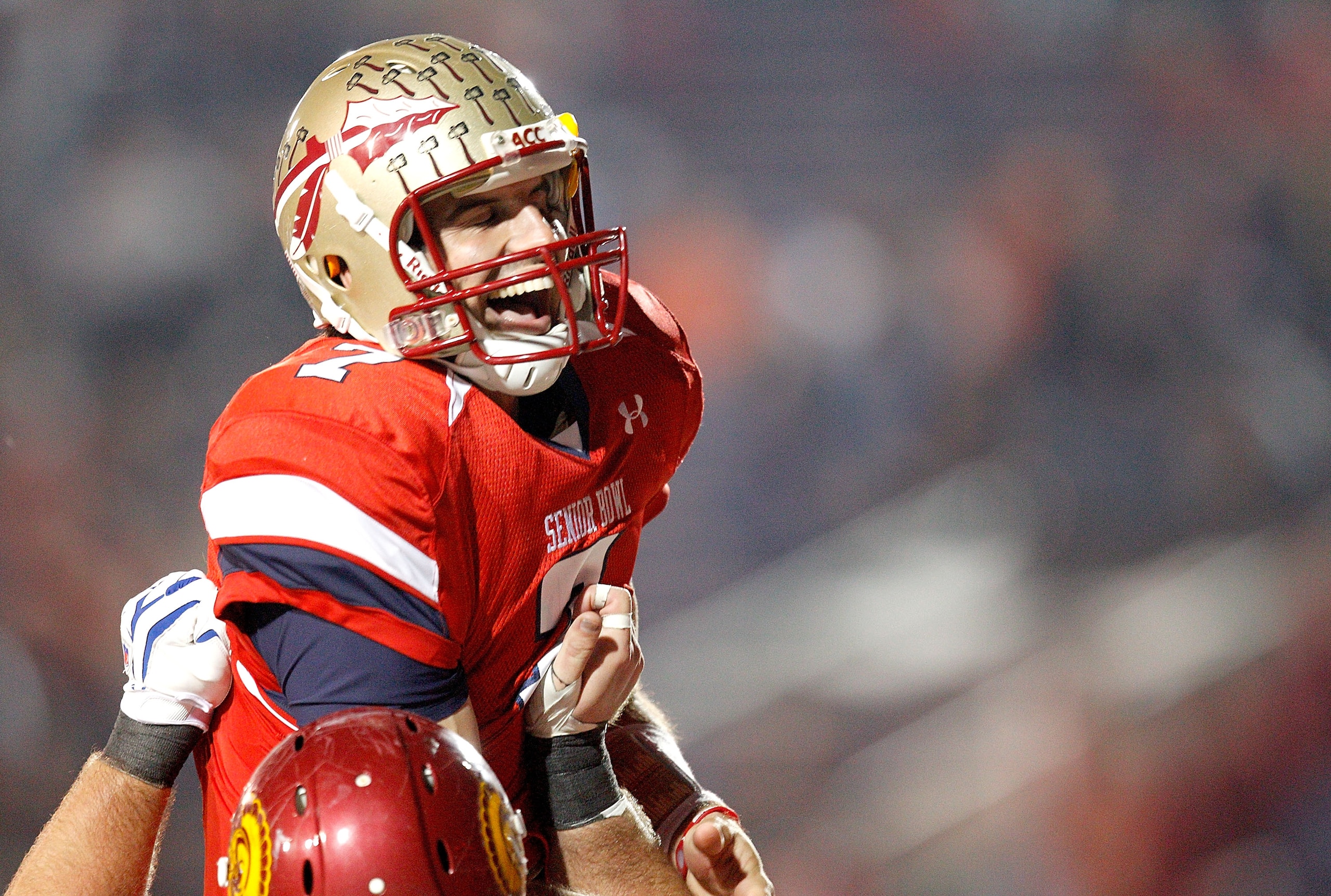 MOBILE, AL - JANUARY 29:  Quarterback Christian Ponder #7 of the South Team  is hoisted into the air while celebrating after passing for a touchdown to wide receiver Jeremy Kerley #84 against the North Team during the fourth quarter of the Under Armour Se